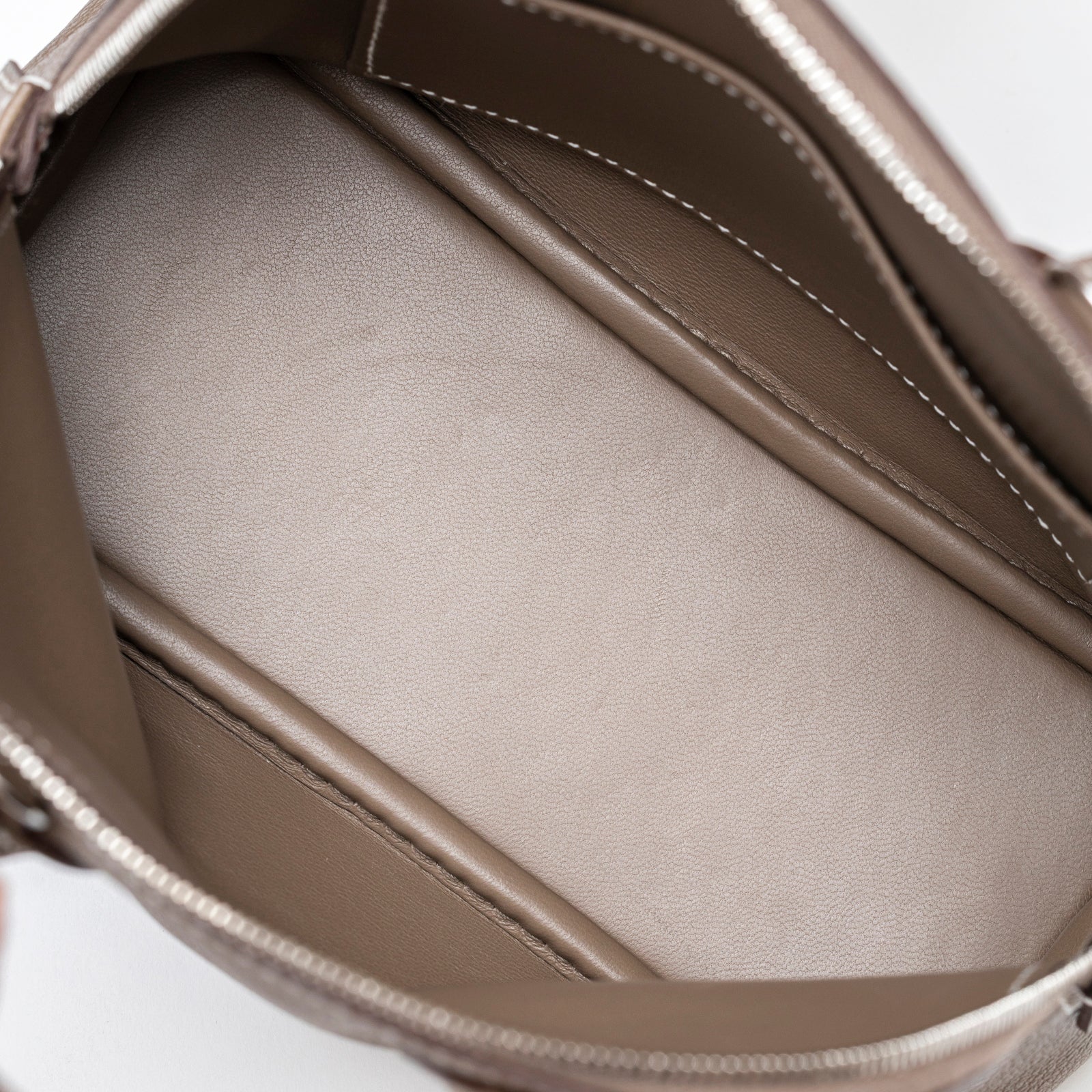 Interior close-up of Hermès 1923 Bolide Mini Etoupe Evercolor Palladium Hardware showing smooth leather lining and stitching detail