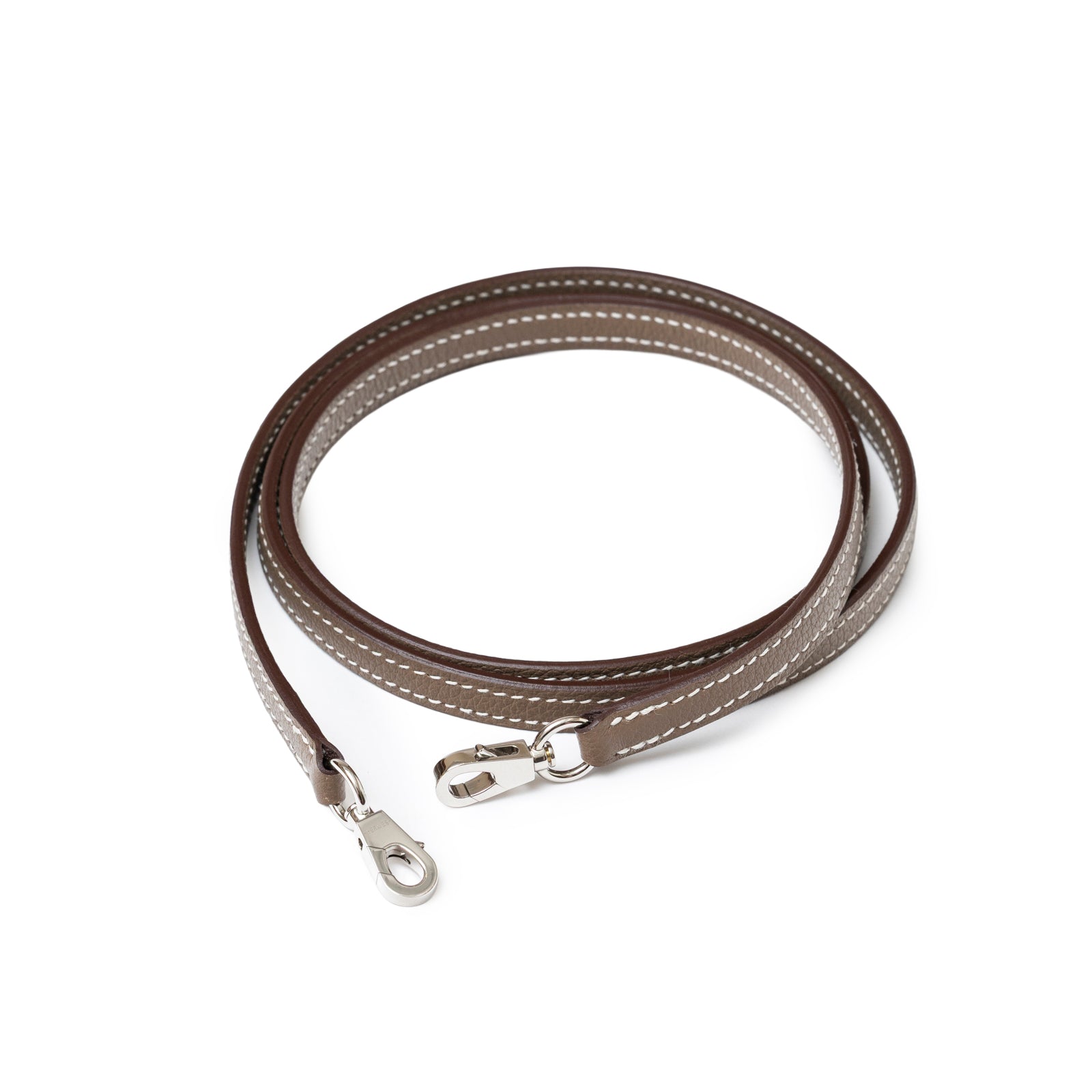 Close-up top view of Hermès 1923 Bolide Mini Etoupe Evercolor Palladium Hardware detachable strap with silver clasps