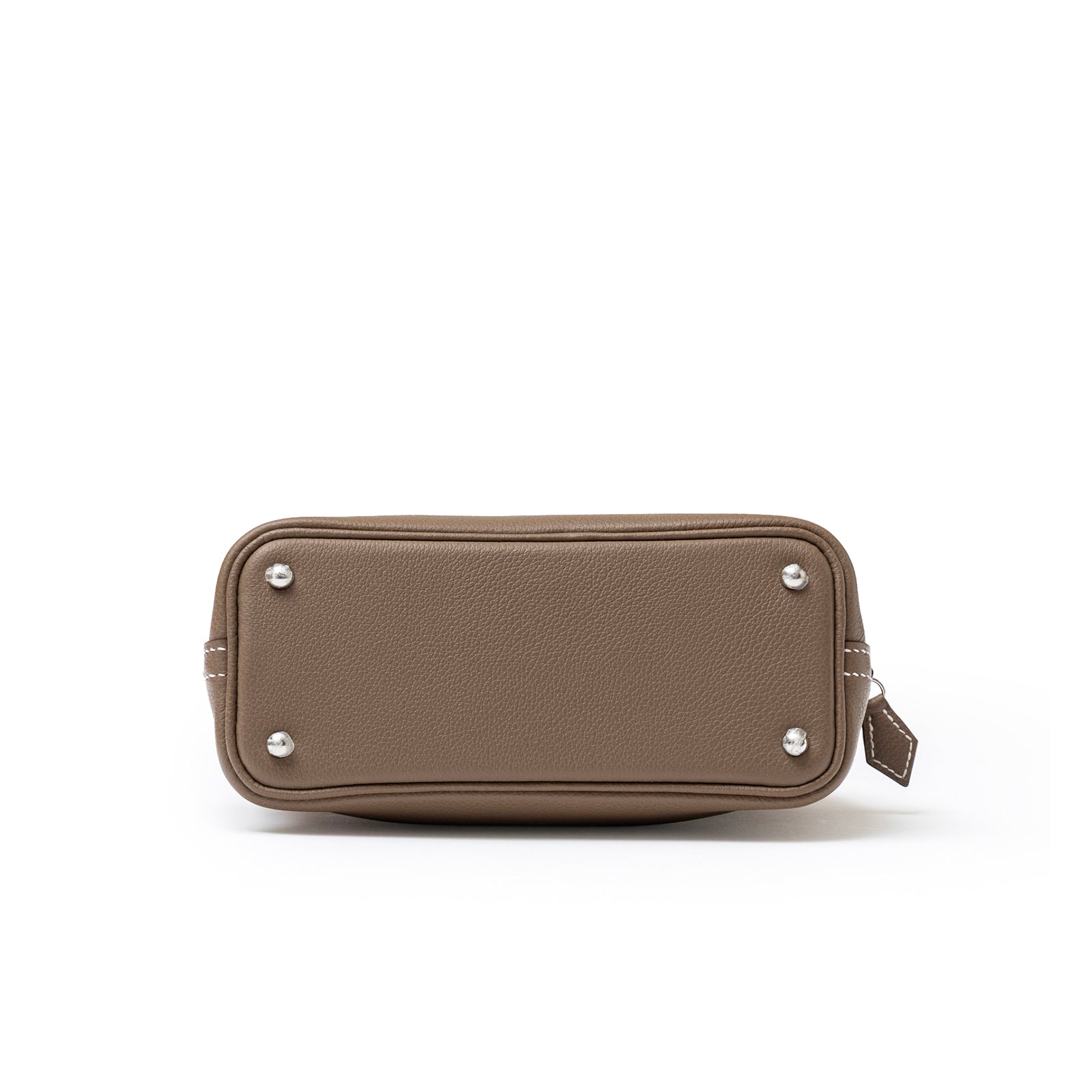 Bottom view of Hermès 1923 Bolide Mini Etoupe Evercolor Palladium Hardware showing leather texture and metal feet