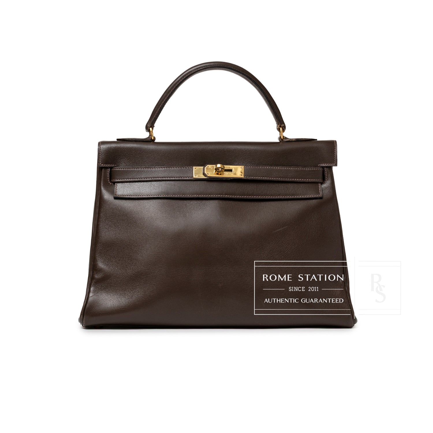 Front view of Hermès 1974 Vintage Kelly 32 Marron Foncé Box Gold Hardware with smooth leather and gold clasp