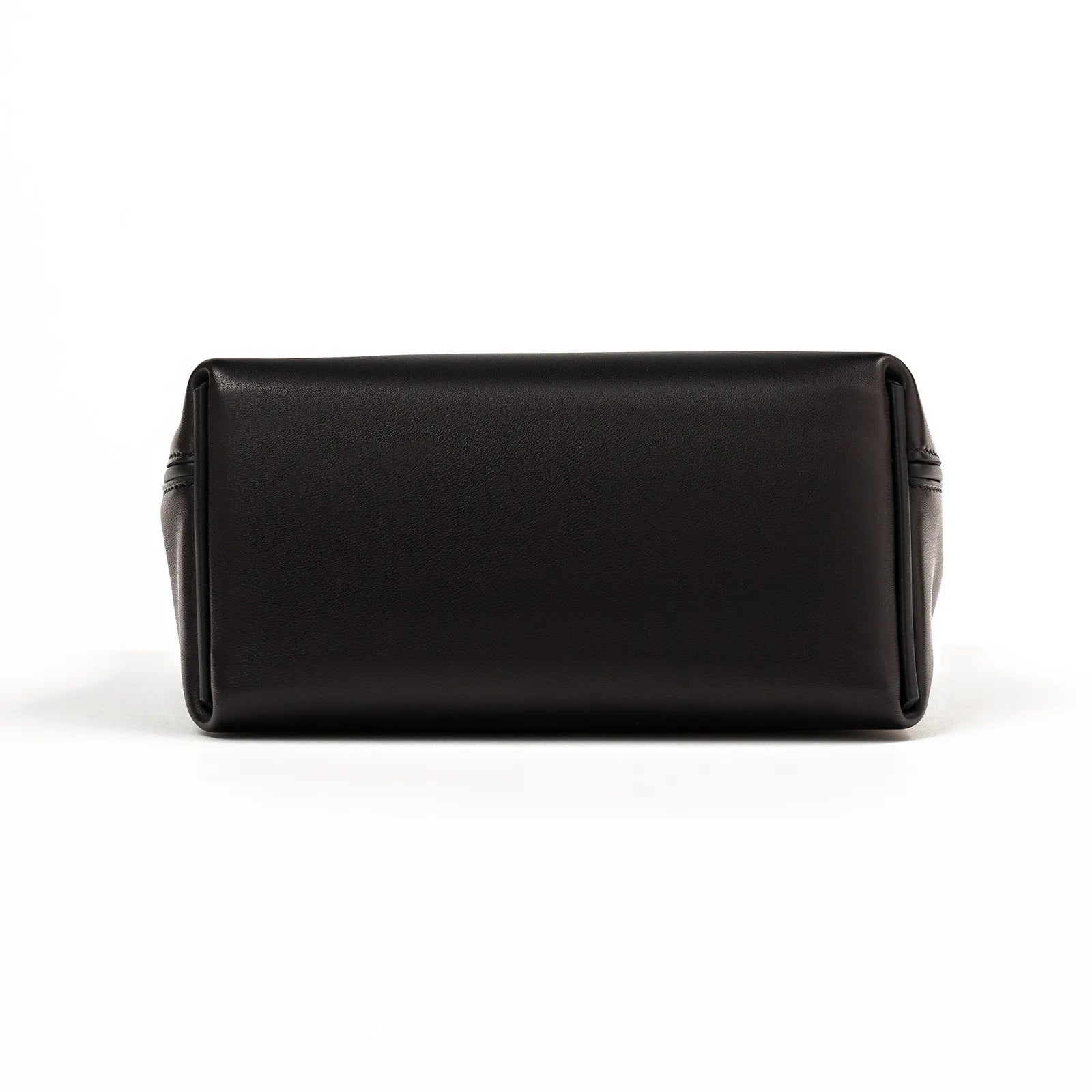 Bottom view of Hermès 24/24 21 black leather bag showing smooth base and side detailing with a clean finish
