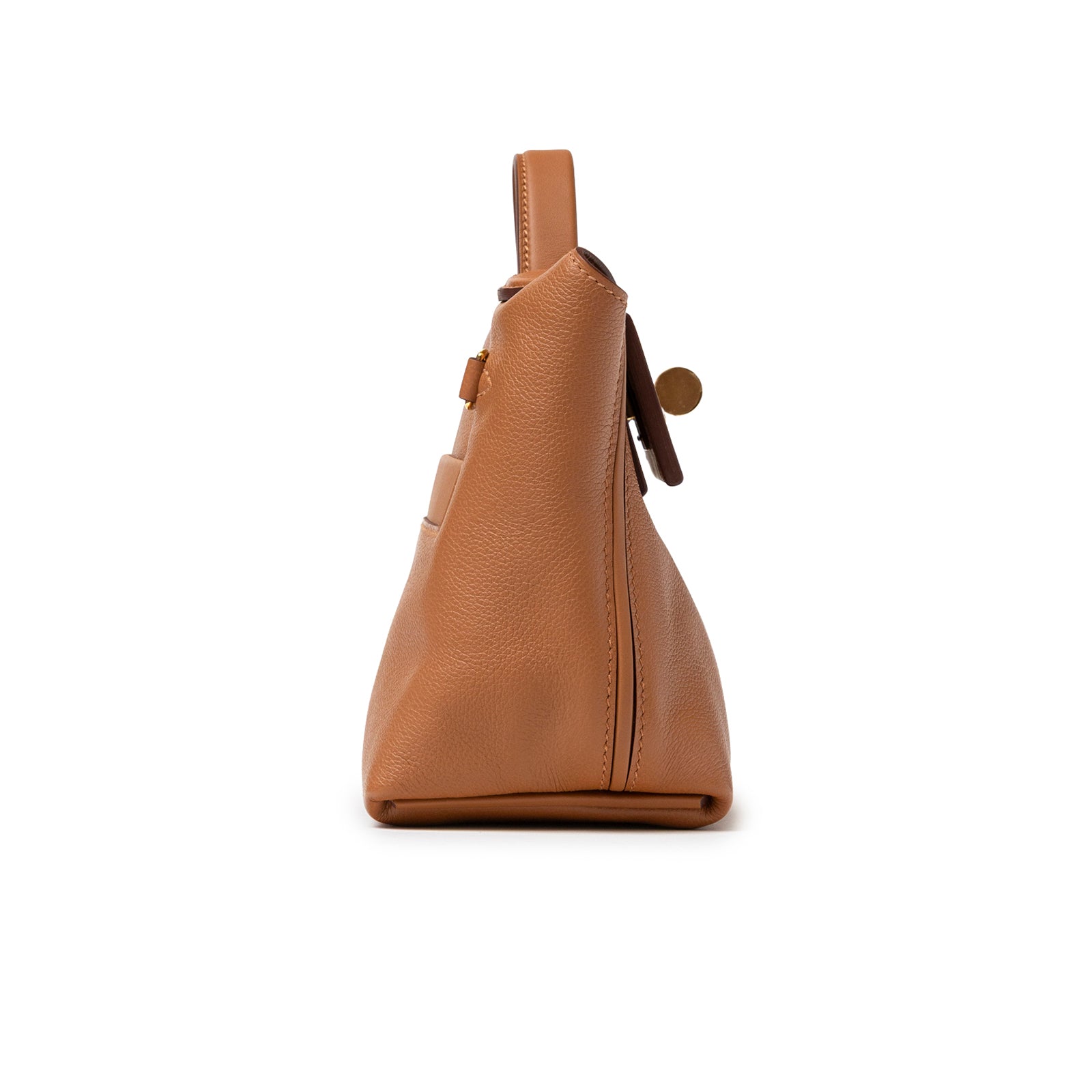 Side view of Hermès 24/24 21 Gold Evercolor Swift Gold Hardware in tan with visible leather texture