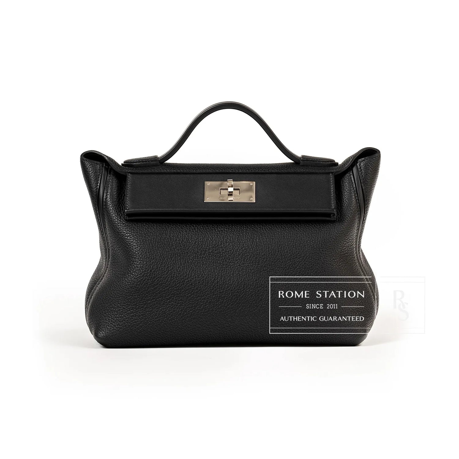 Front view of Hermès 24/24 29 black Taurillon Maurice leather bag with palladium clasp hardware.