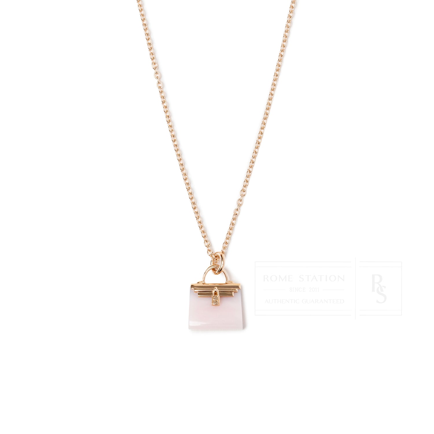 Close-up front view of Hermès Amulettes Kelly Pendant Pink Opal Gemstone 18K Rose Gold necklace
