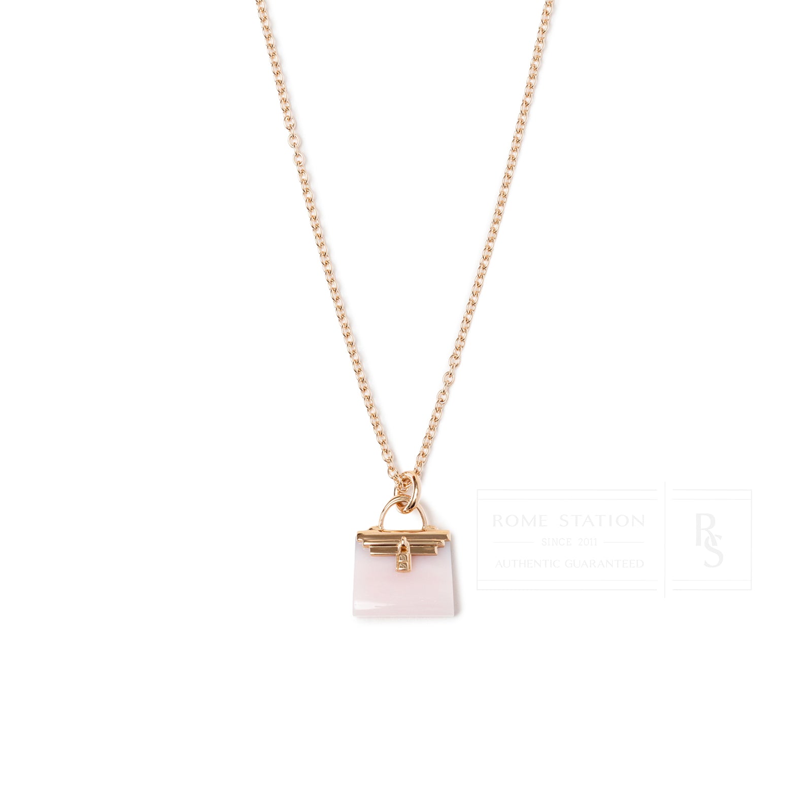 Close-up front view of Hermès Amulettes Kelly Pendant Pink Opal Gemstone 18K Rose Gold necklace
