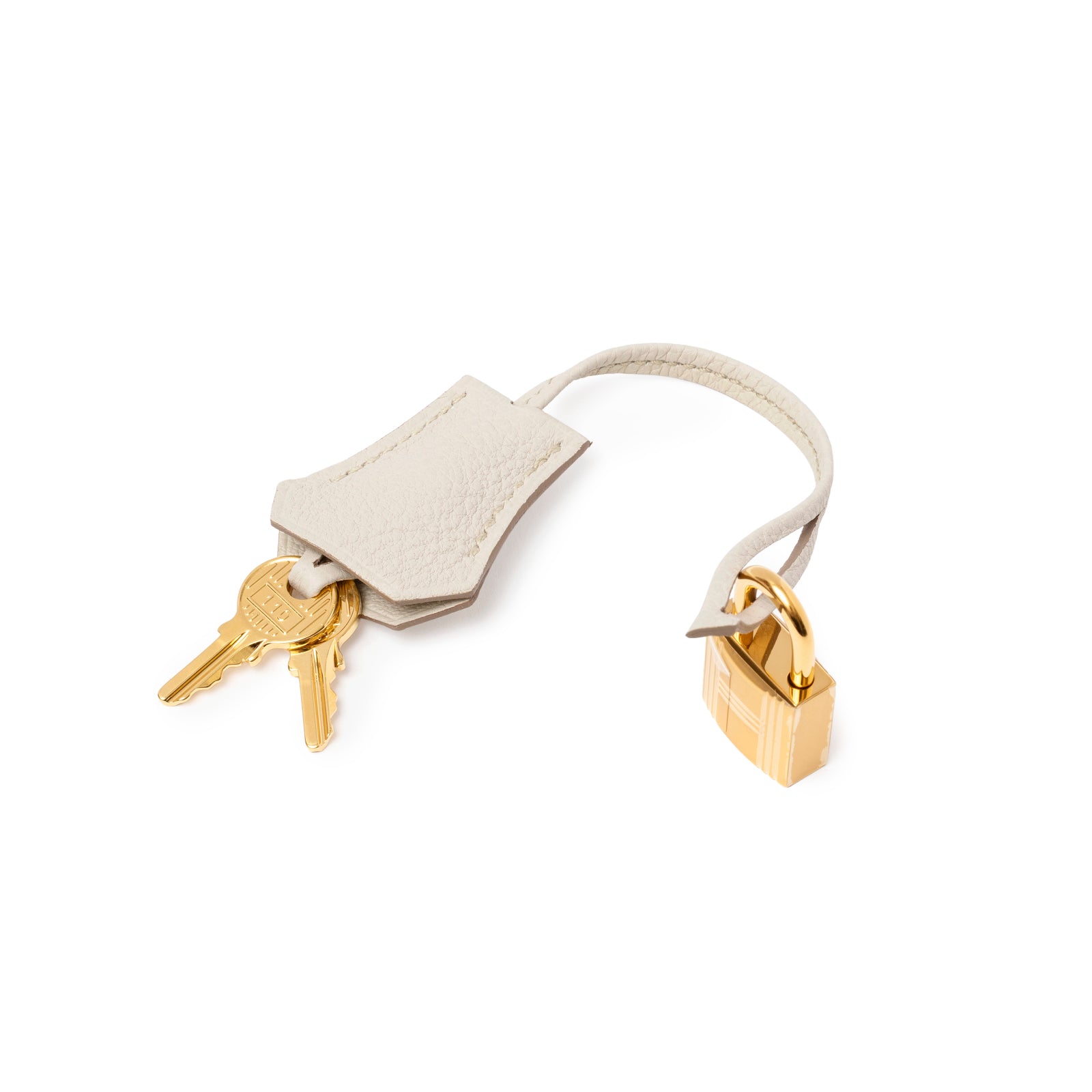 Gold padlock and keys with textured leather clochette on Hermès Birkin 25 Beton Togo Gold Hardware accessory