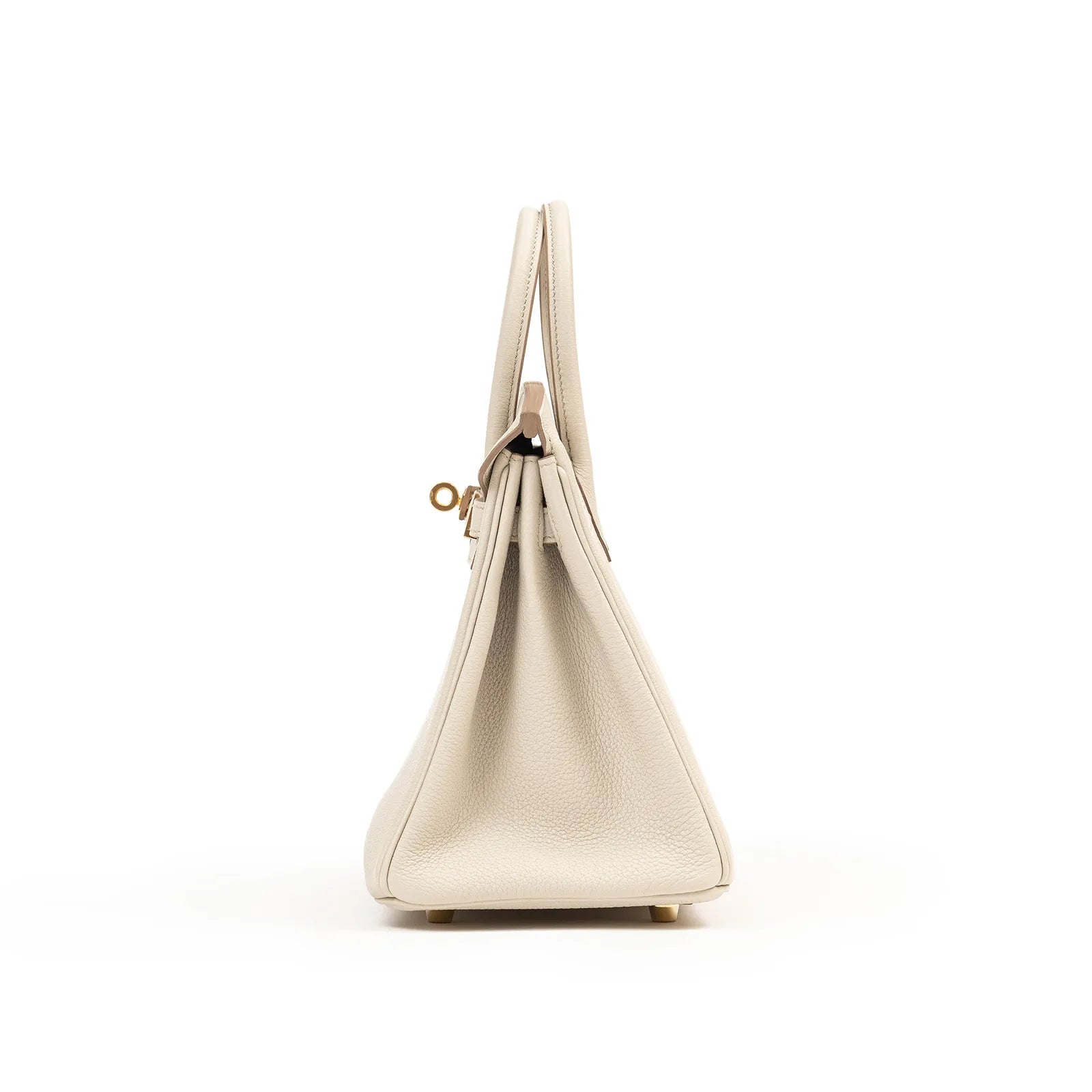 Side profile of Hermès Birkin 25 in beton togo leather showcasing gold hardware and textured leather grain.