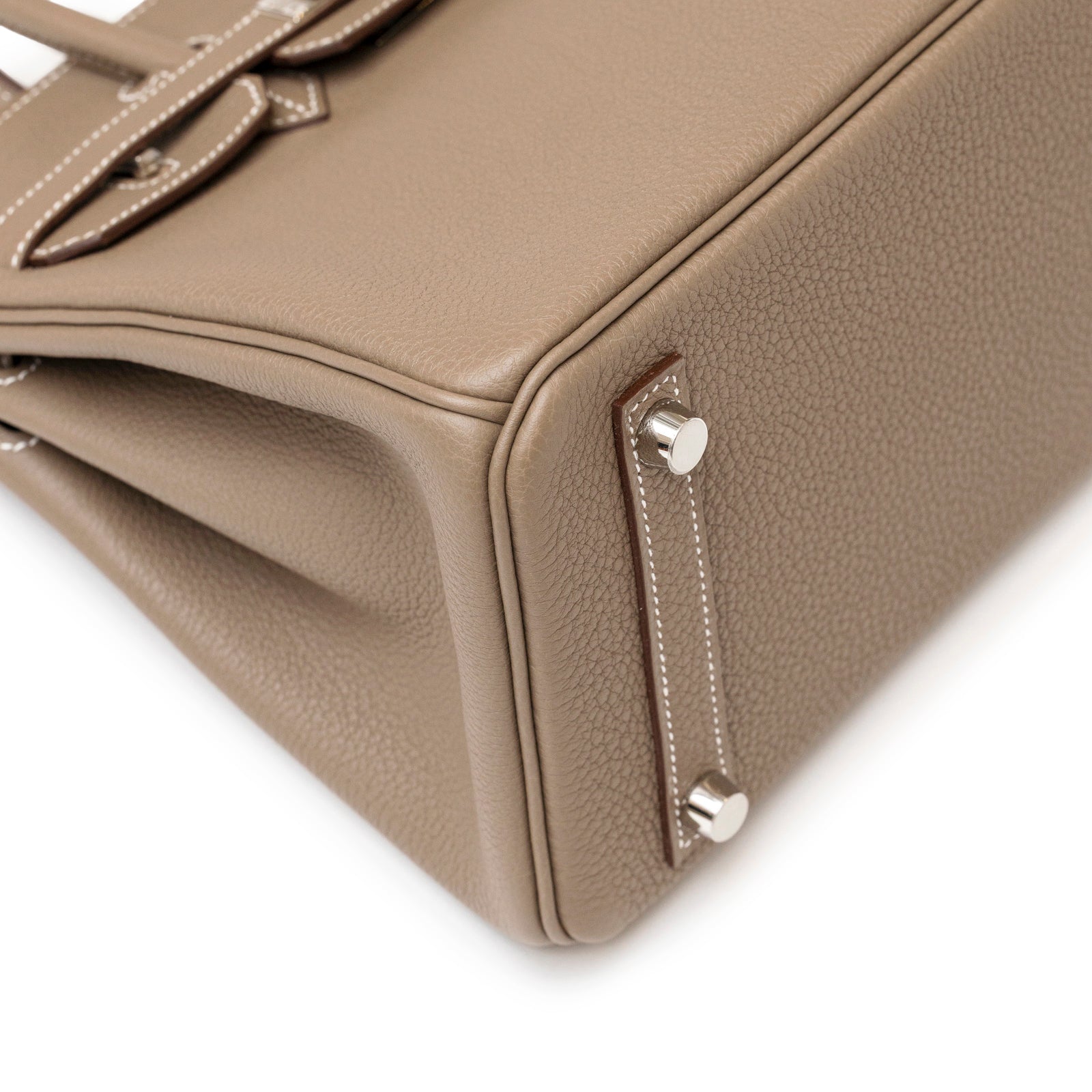 Close-up of the bottom corner showing palladium hardware and textured leather on Hermès Birkin 25 Etoupe Togo Palladium Hardware