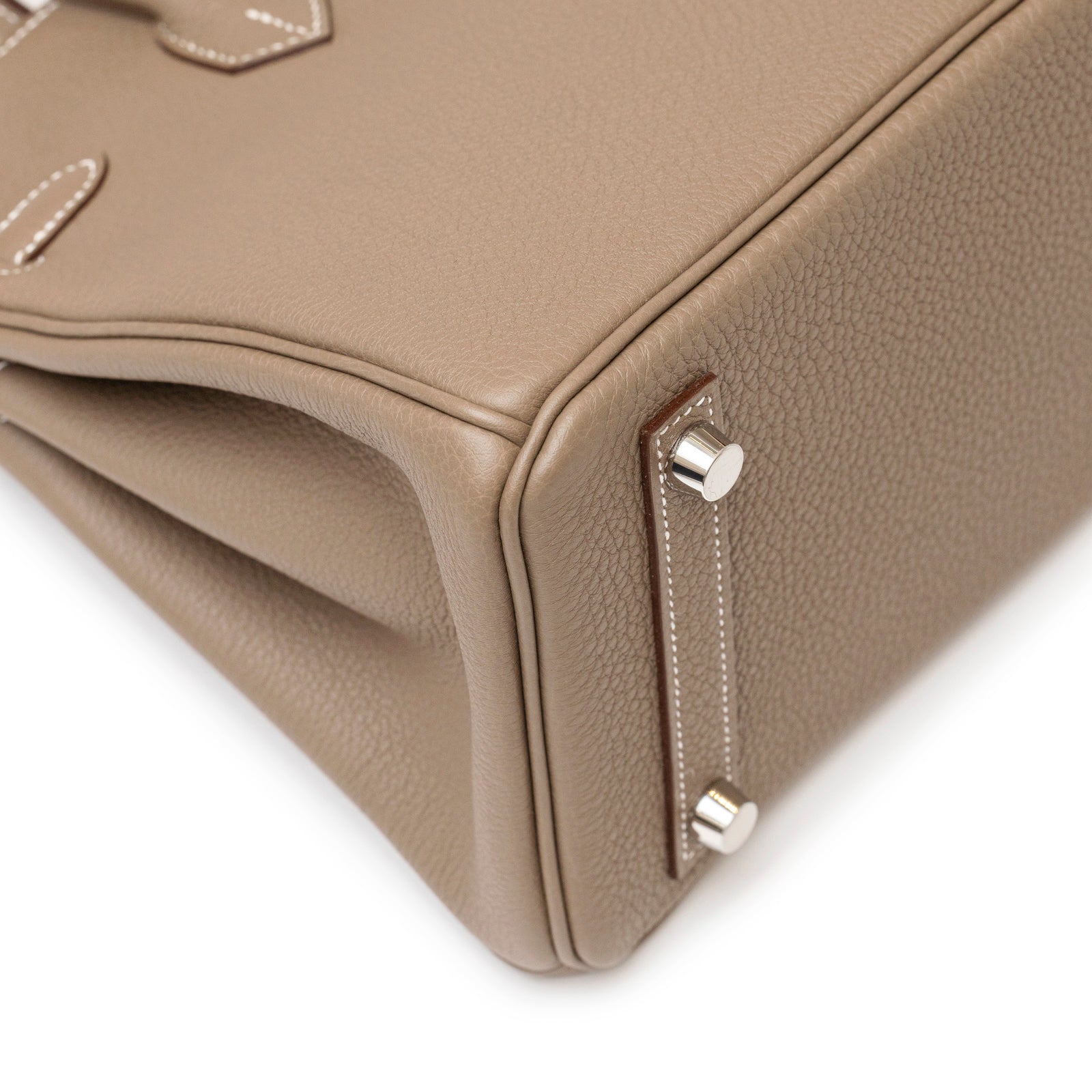 Close-up of the bottom corner showing textured leather and palladium hardware on Hermès Birkin 25 Etoupe Togo Palladium Hardware