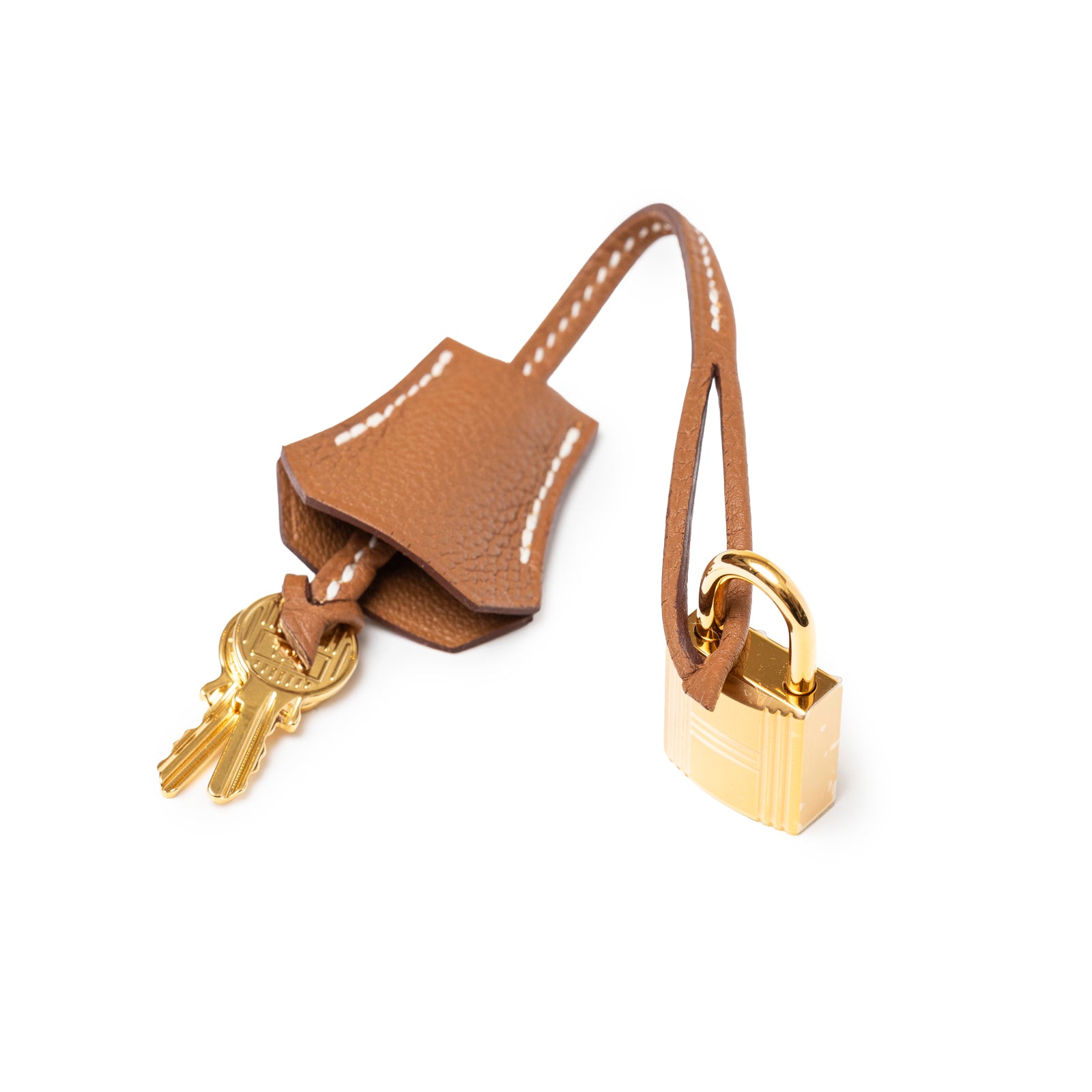 Close-up of Hermès Birkin 25 Gold Togo Gold Hardware leather clochette with keys and gold padlock detail