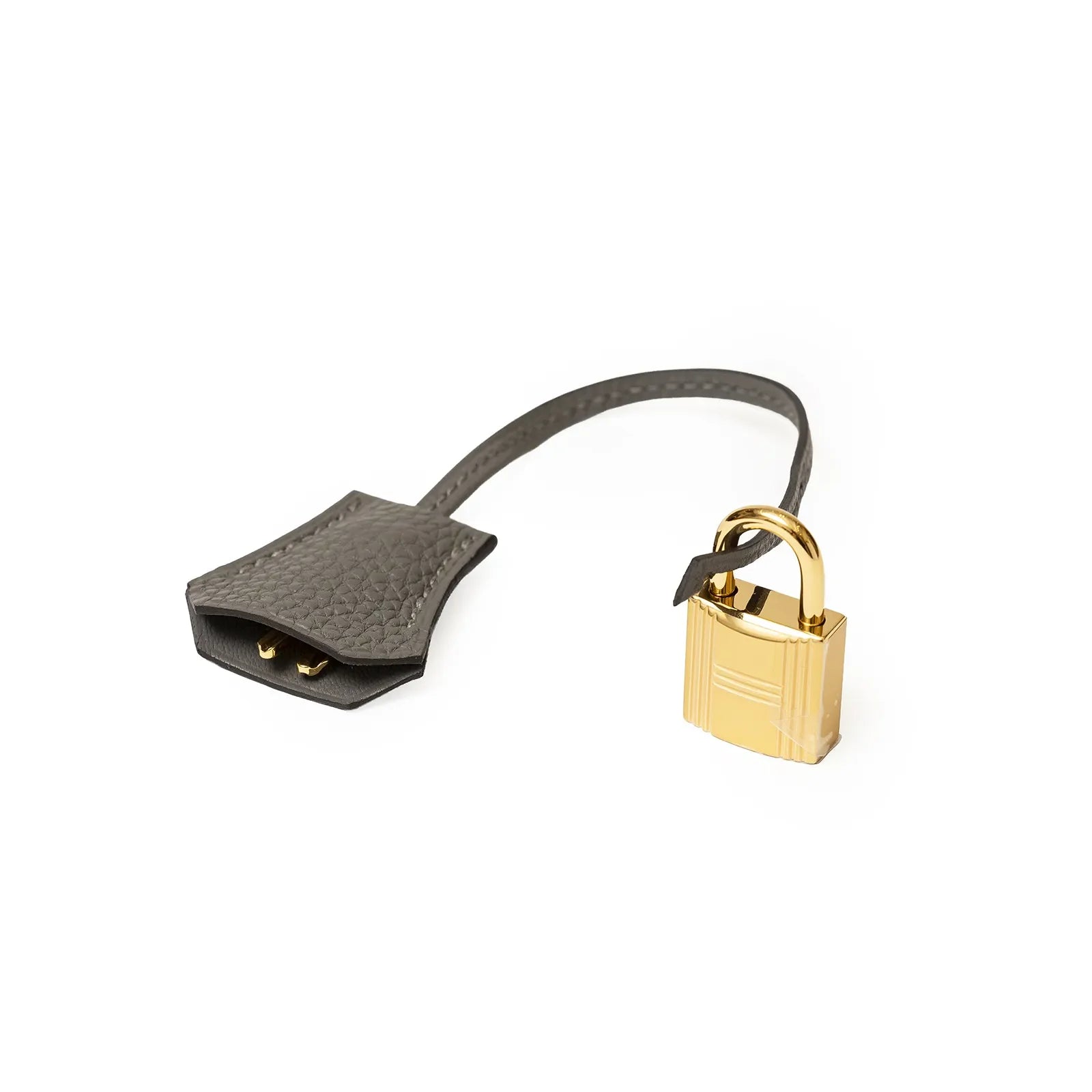 Close-up view of gold padlock attached to gray leather clochette for Hermès Birkin bag accessory