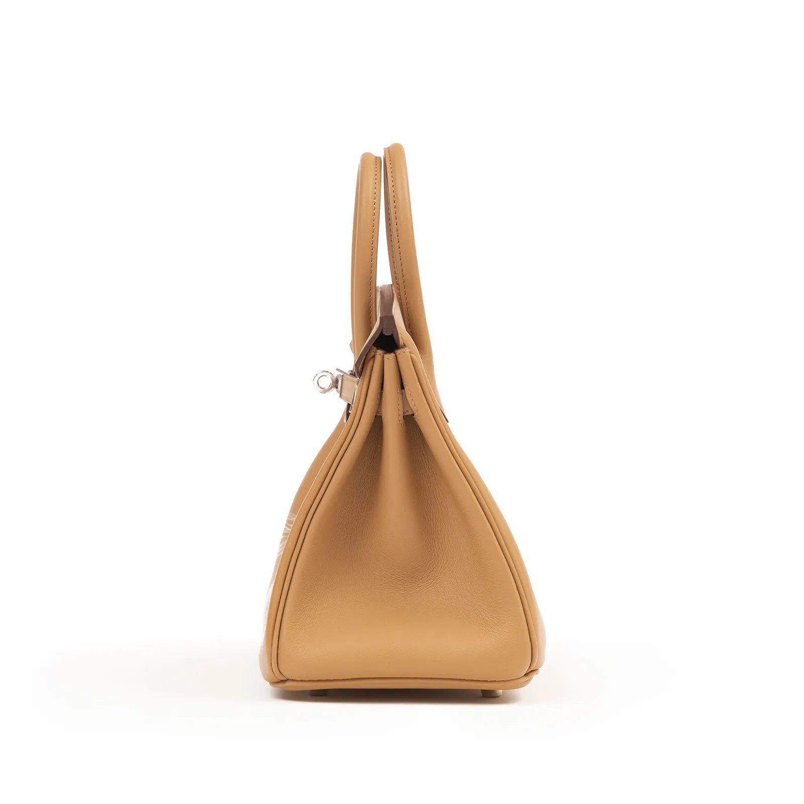 Side view of Hermès Birkin 25 in biscuit leather featuring soft curves and palladium hardware details