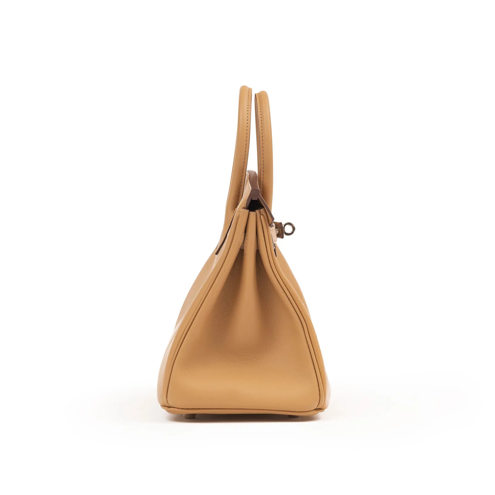 Side view of Hermès Birkin 25 in biscuit Swift leather with palladium hardware showing slim profile and handle design