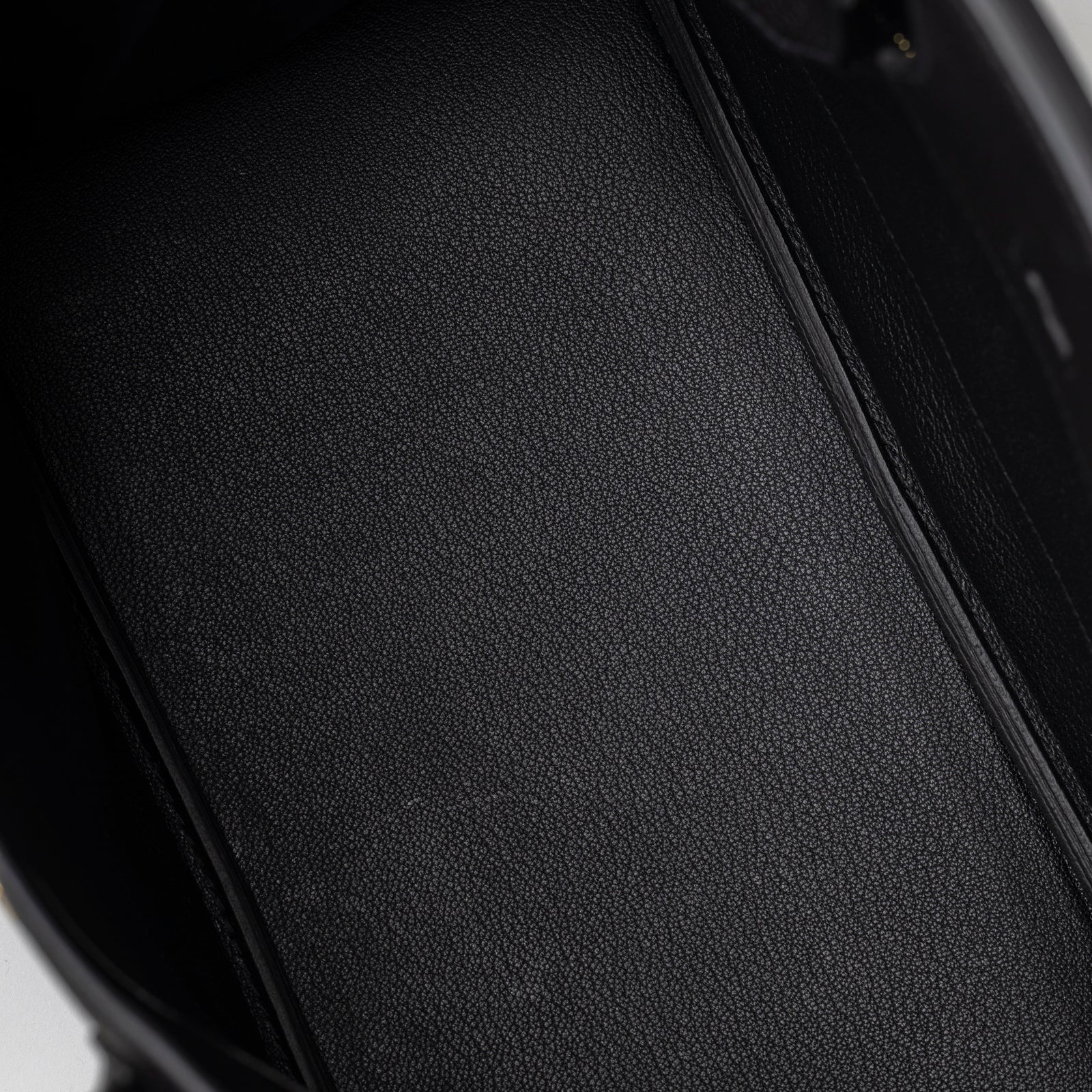 Close-up interior view showing smooth black leather lining inside Hermès Birkin 30 Black Togo Gold Hardware
