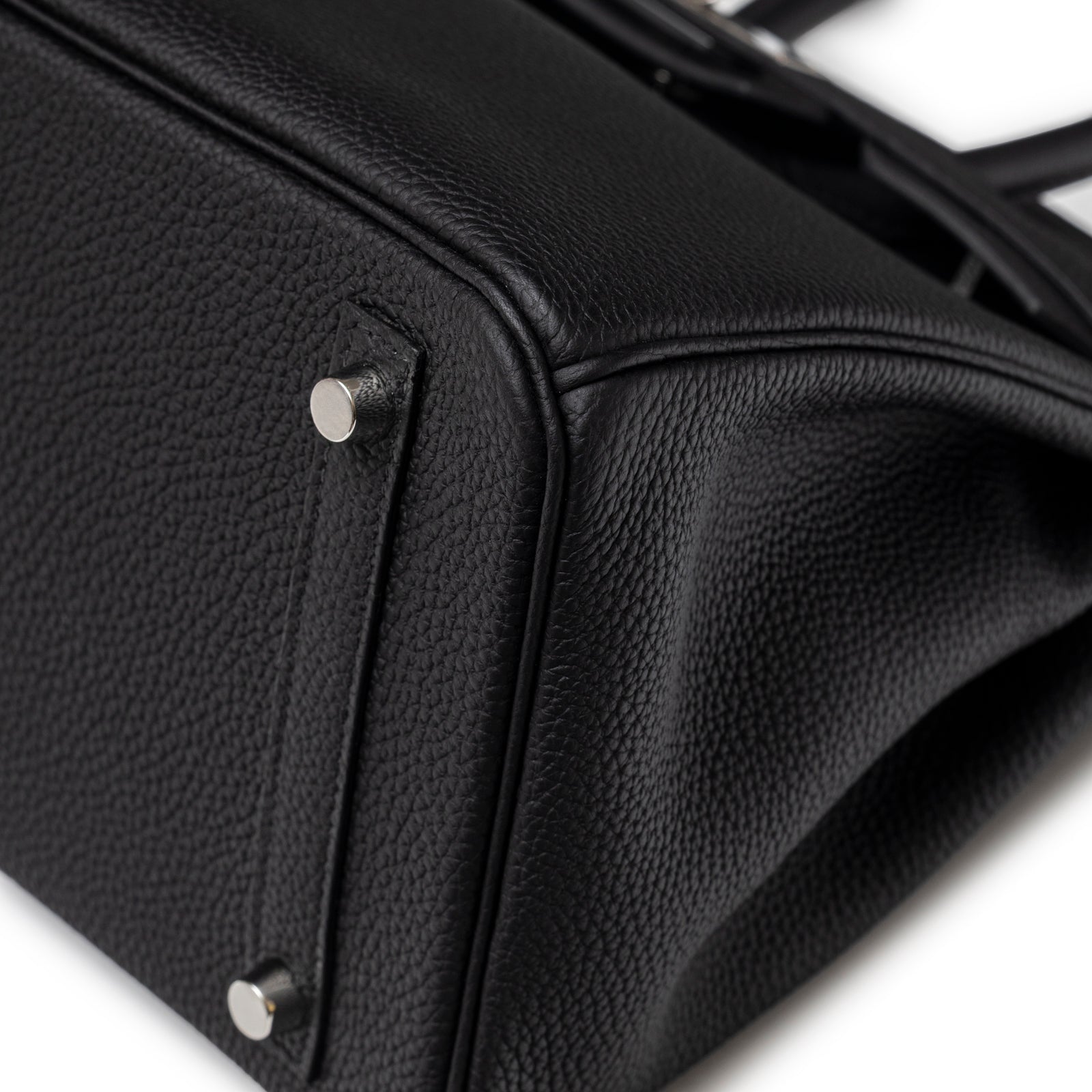 Close-up of bottom corner and palladium feet on Hermès Birkin 30 Black Togo Palladium Hardware handbag