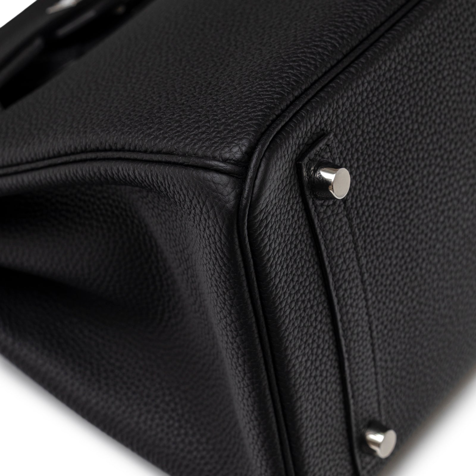 Close-up of bottom corner and palladium feet on Hermès Birkin 30 Black Togo Palladium Hardware handbag