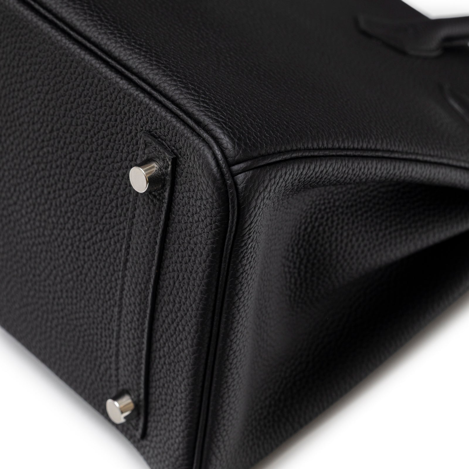 Close-up of bottom corner and palladium feet on Hermès Birkin 30 Black Togo Palladium Hardware handbag