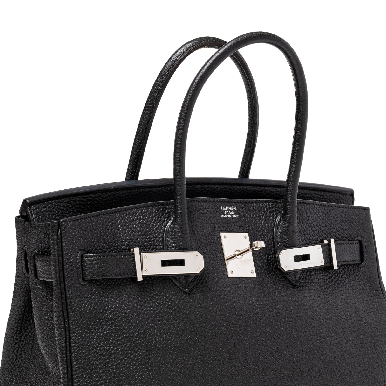 Angled close-up of Hermès Birkin 30 Black Togo Palladium Hardware showing leather texture and polished clasp detail.