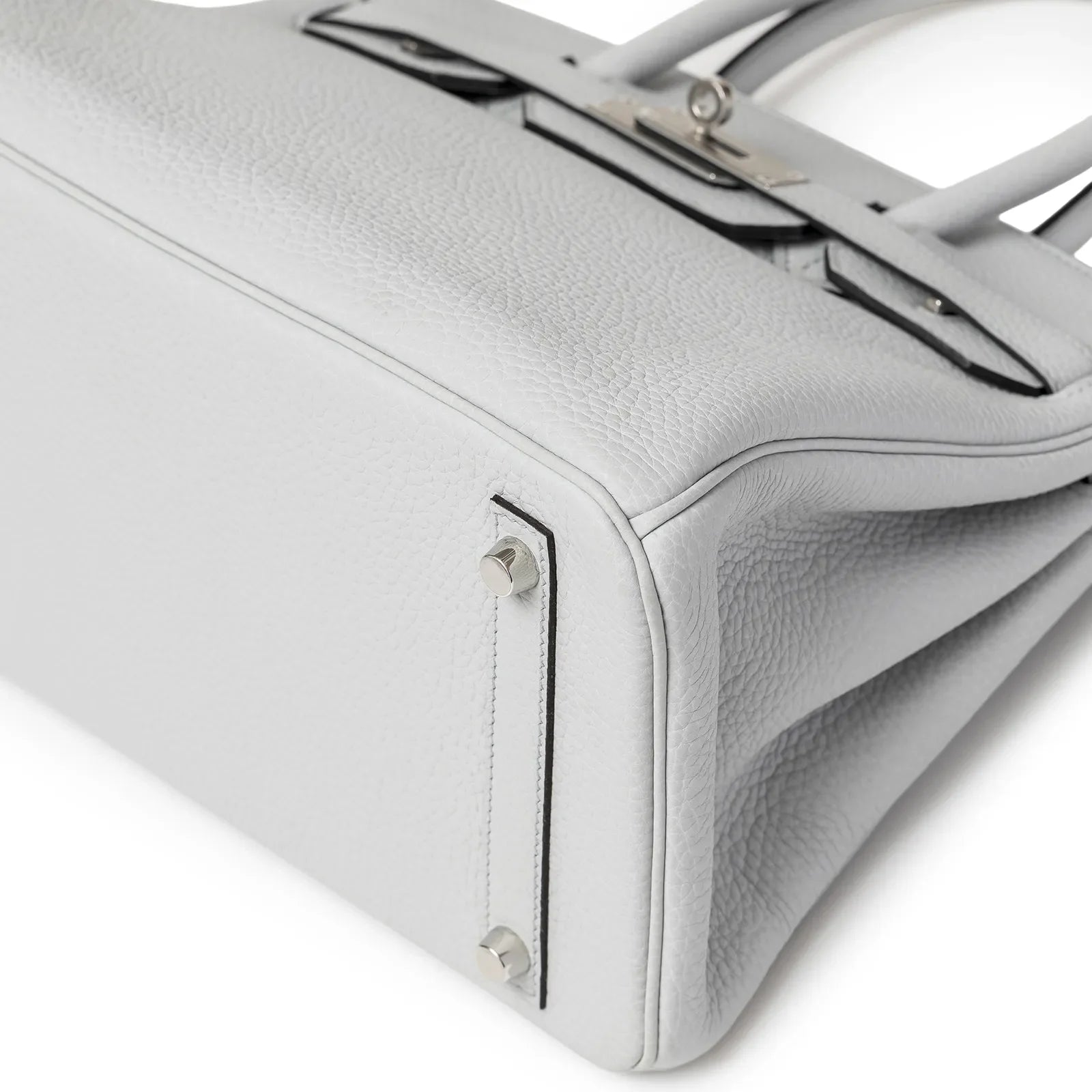 Close-up angled view of bottom and side of Hermès Birkin 30 Bleu Pale Clemence leather with palladium feet