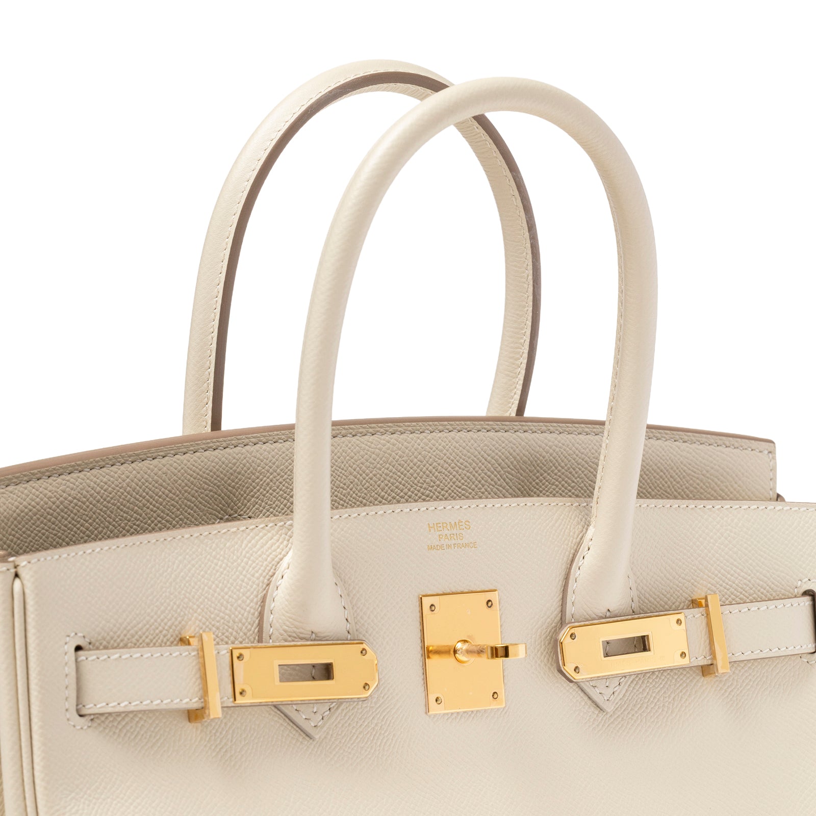 Angled close-up of Hermès Birkin 30 Craie Epsom Gold Hardware showing cream leather handles and gold lock closure detail