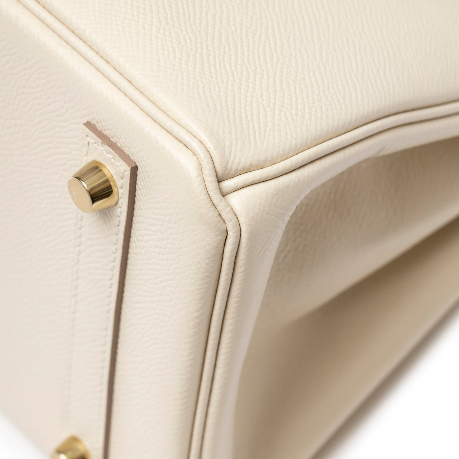 Close-up of Hermès Birkin 30 Craie Epsom Gold Hardware corner showing cream textured leather and gold feet detail