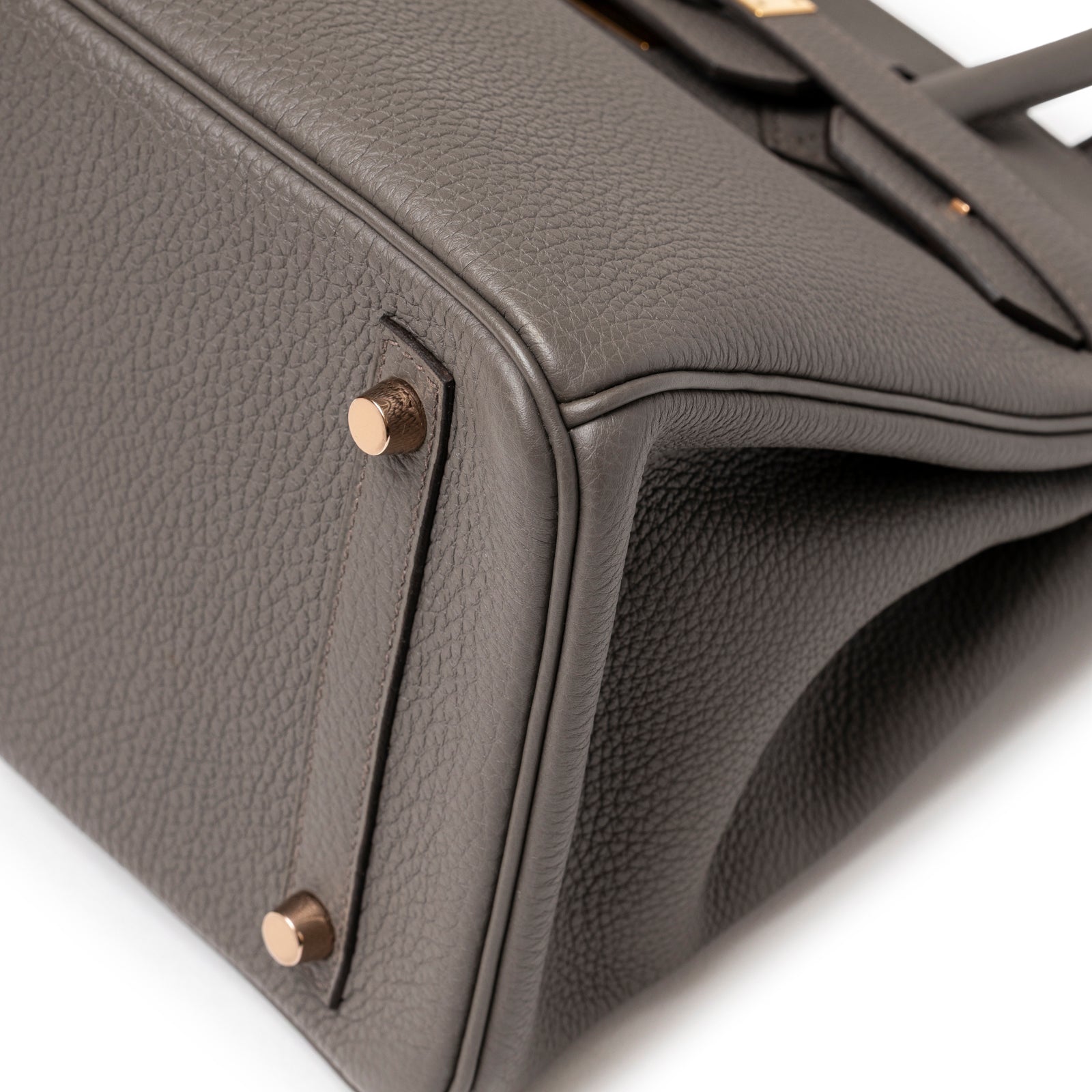 Close-up of corner on Hermès Birkin 30 Etain Togo Rose Gold Hardware showing textured leather and rose gold feet