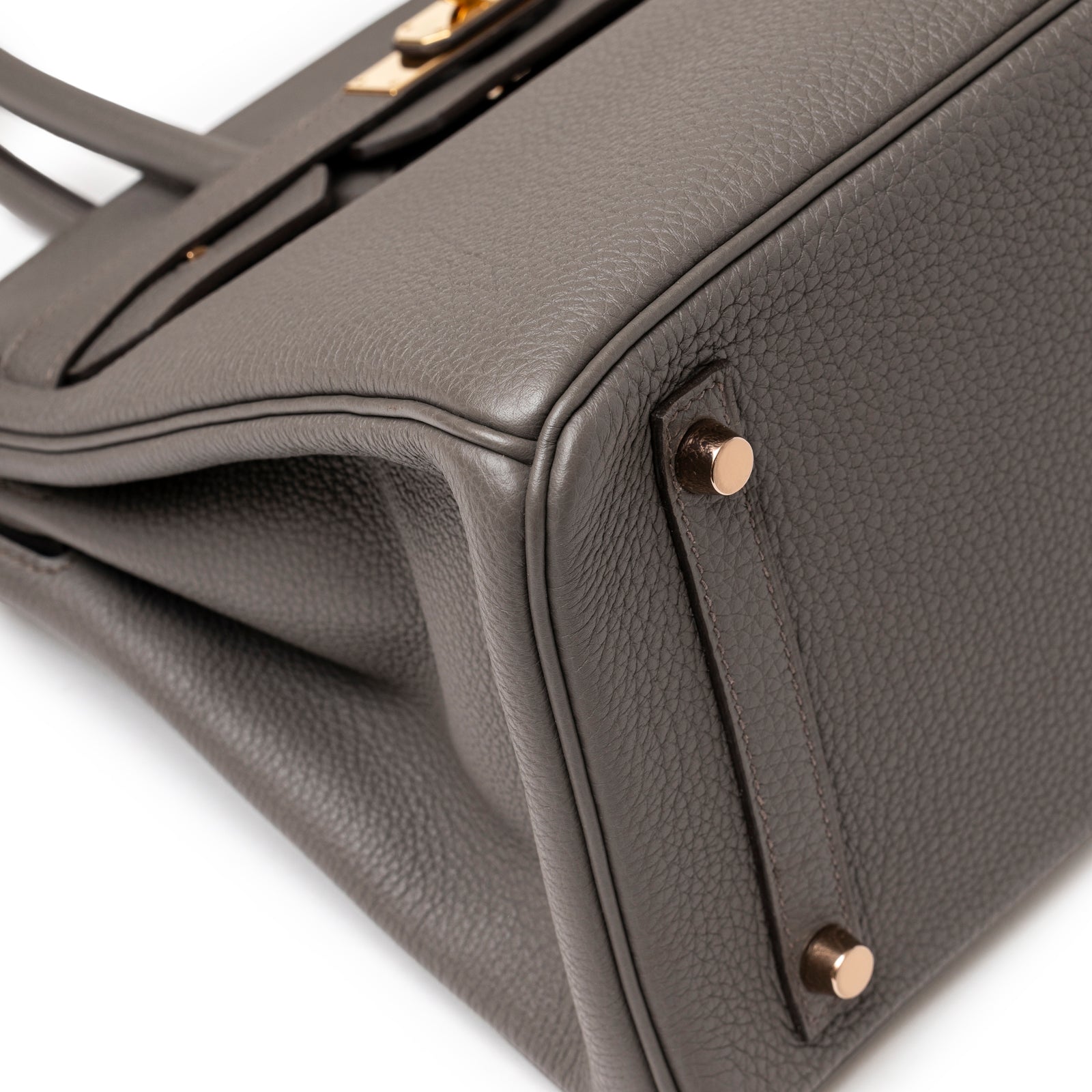 Close-up of Hermès Birkin 30 Etain Togo Rose Gold Hardware corner showcasing textured leather and rose gold feet