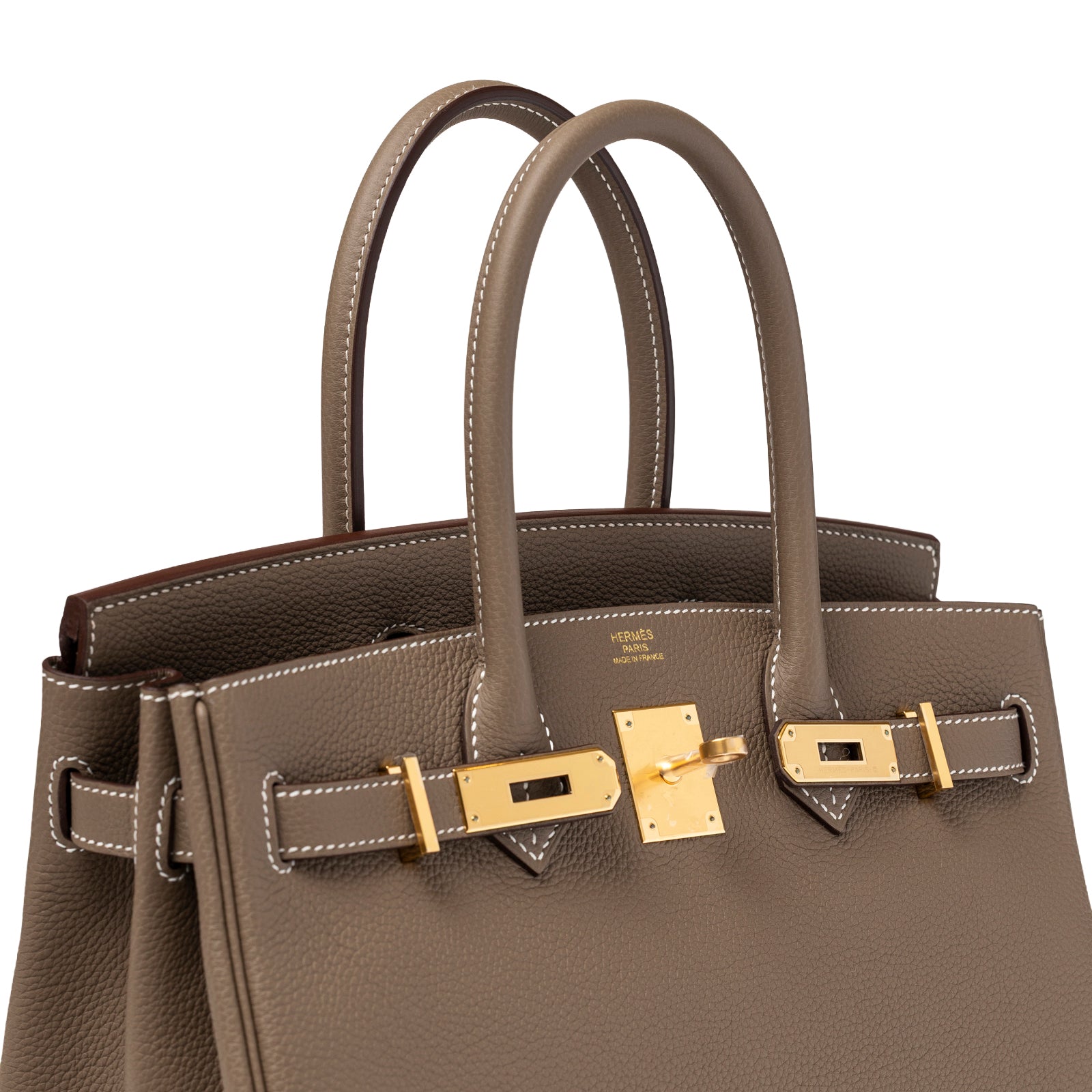 Angled close-up of Hermès Birkin 30 Etoupe Togo Gold Hardware showing gold clasp