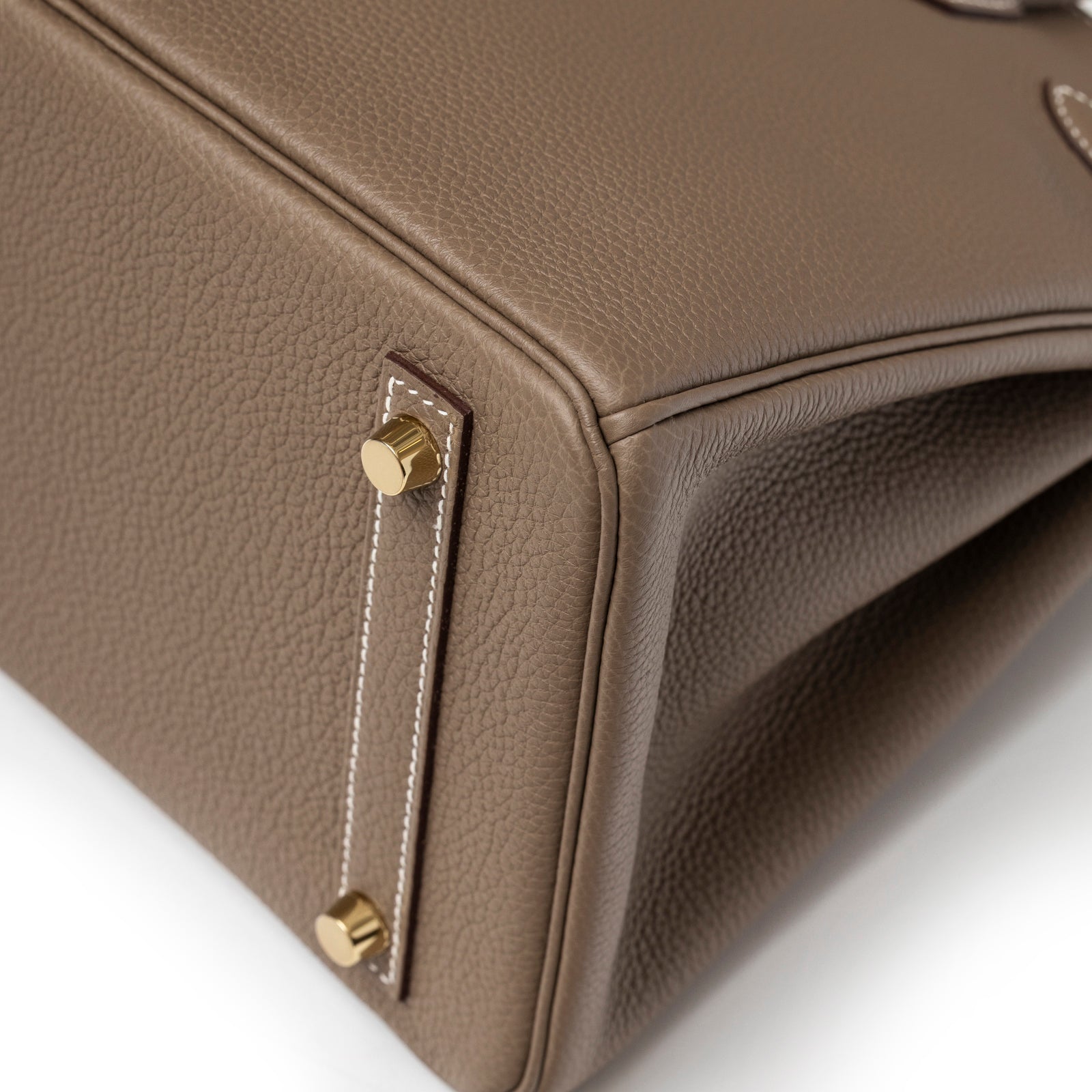 Close-up of corner stitching and gold feet on Hermès Birkin 30 Etoupe Togo Gold Hardware handbag bottom side