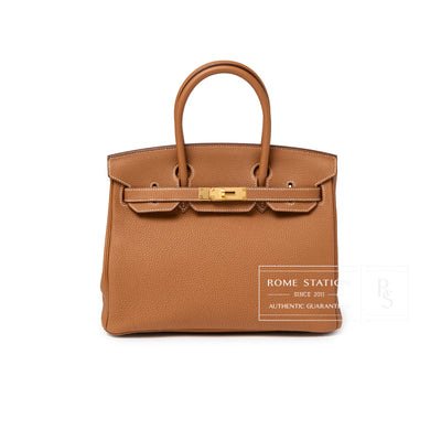Front view of Hermès Birkin 30 Gold Togo Gold Hardware handbag in rich gold leather with polished gold clasp
