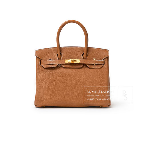 Front view of Hermès Birkin 30 Gold Togo Gold Hardware featuring textured leather and gold clasp detail