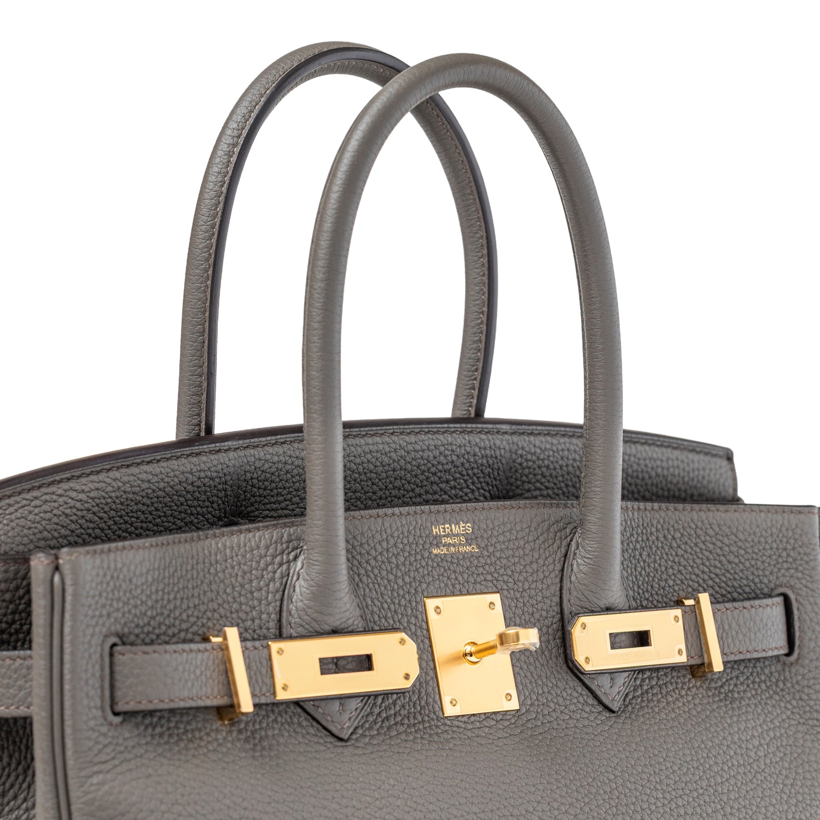 Close-up angled view of Hermès Birkin 30 Gris Meyer Togo Gold Hardware showing textured leather and gold clasp details
