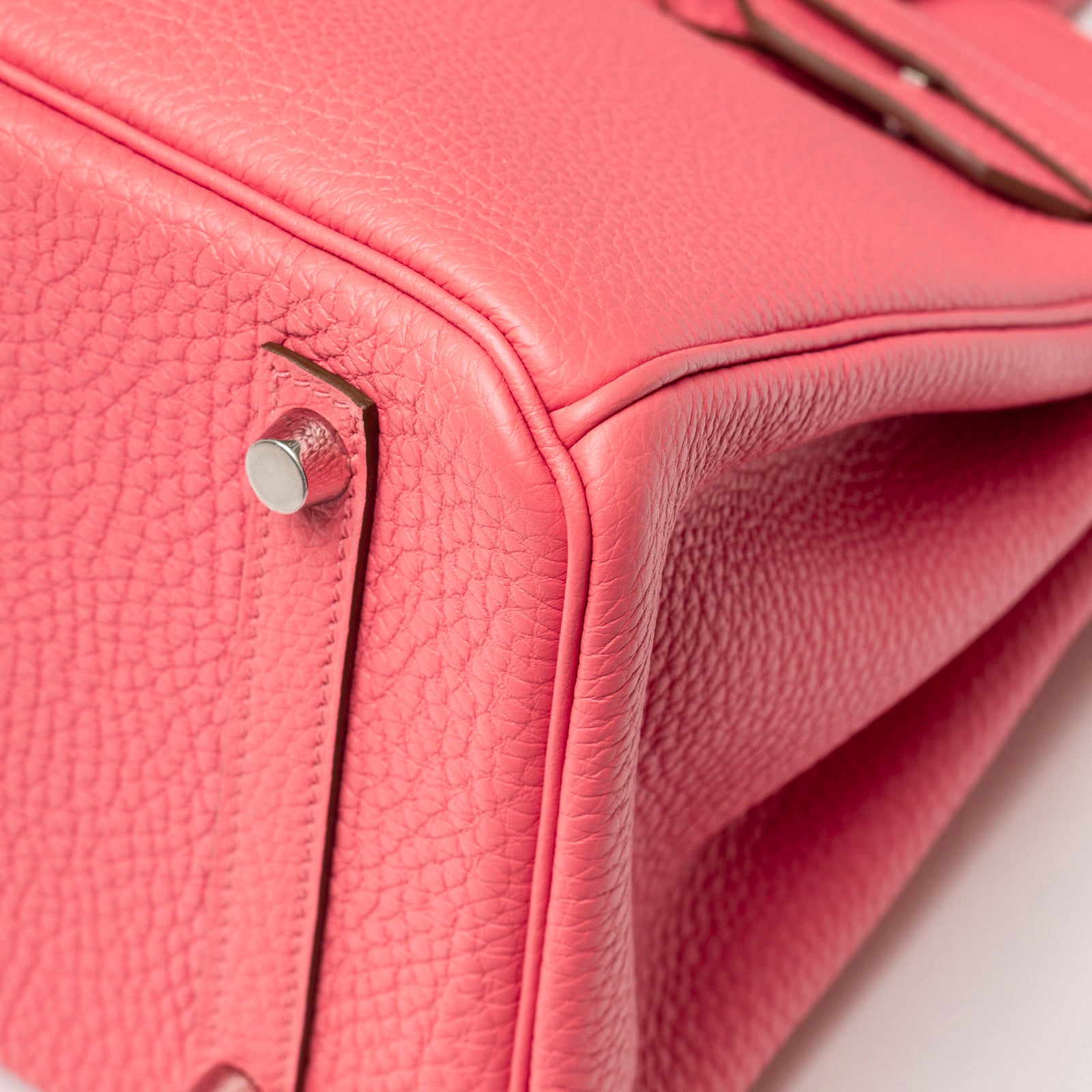 Close-up angled shot of Hermès Birkin 30 Rose Lipstick Togo Palladium Hardware showing leather texture and metal feet detail