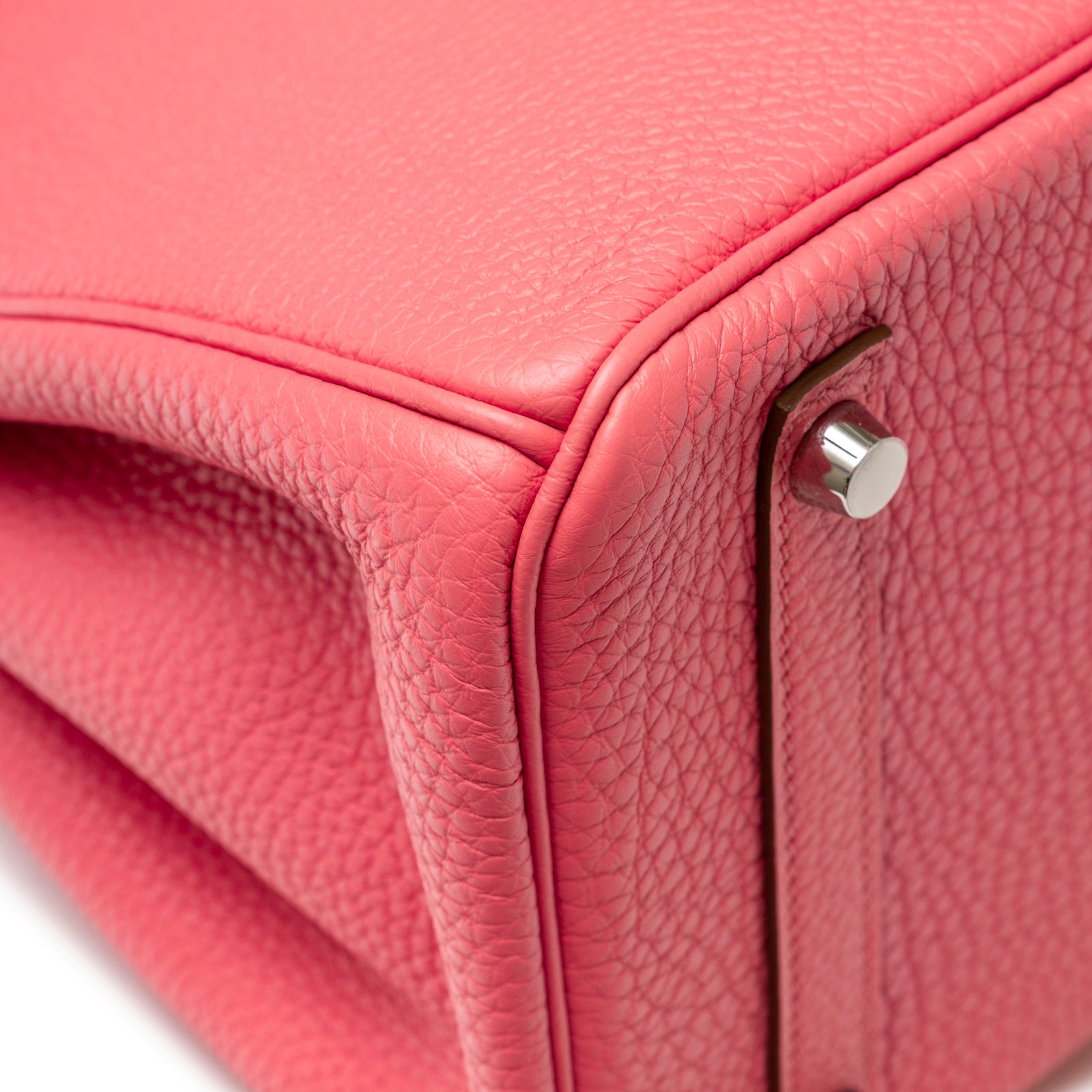 Close-up of corner and hardware detail on Hermès Birkin 30 Rose Lipstick Togo Palladium Hardware bag in textured leather.
