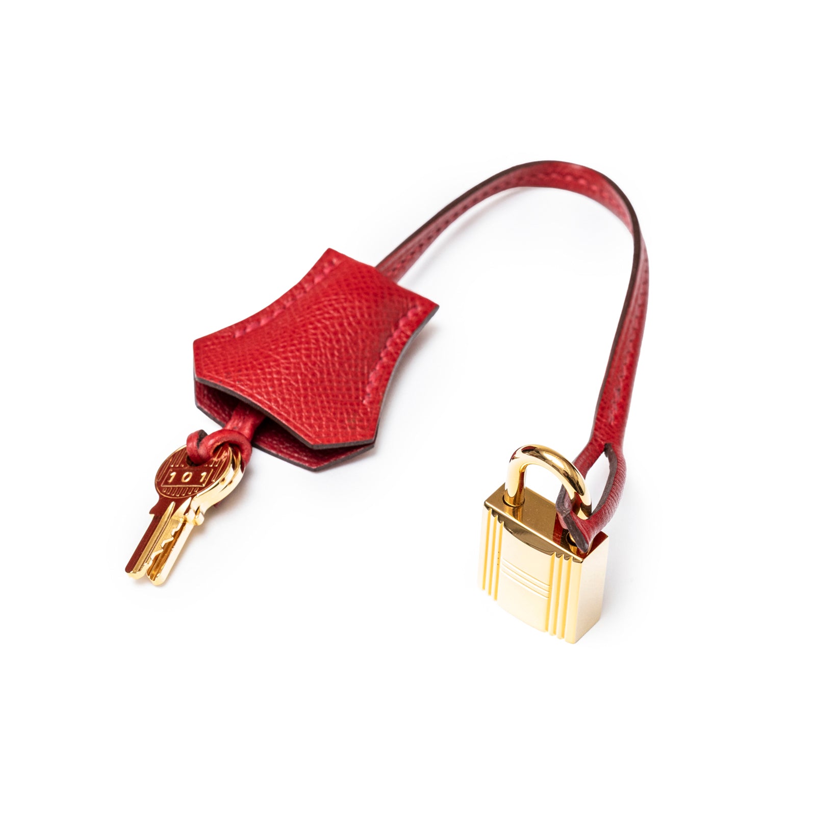 Close-up of Hermès Birkin 30 Rouge Casaque Epsom Gold Hardware lock and key pouch with leather strap