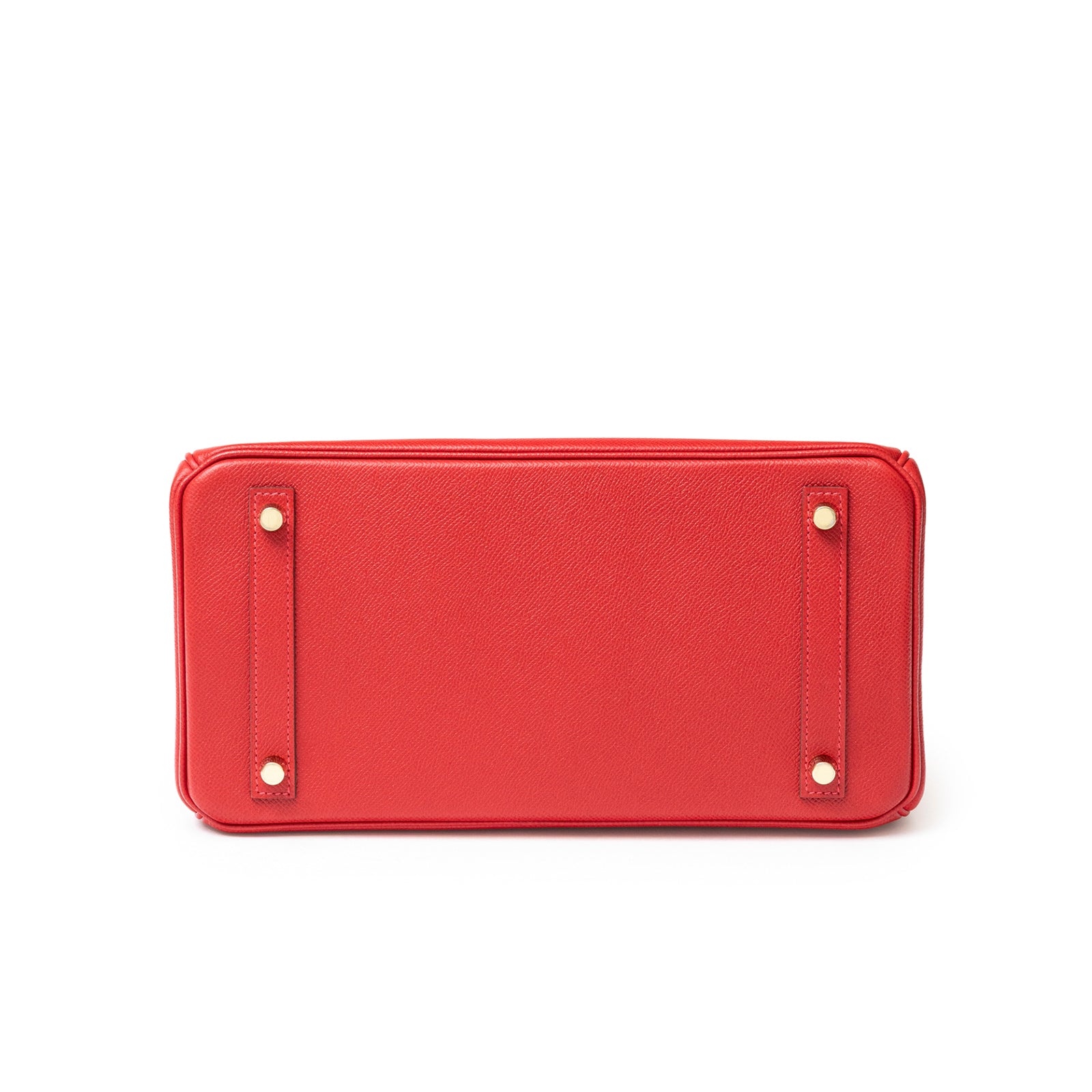 Bottom view of Hermès Birkin 30 Rouge Casaque Epsom Gold Hardware showing leather texture and metal feet details