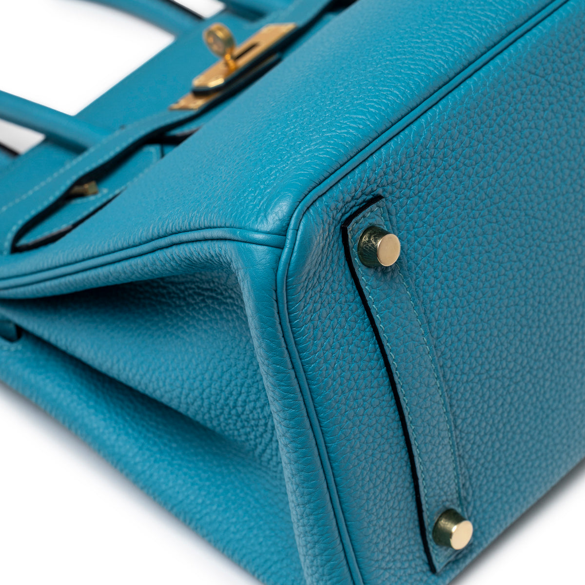 Close-up of bottom corner and gold feet on Hermès Birkin 30 Turquoise Togo Gold Hardware handbag