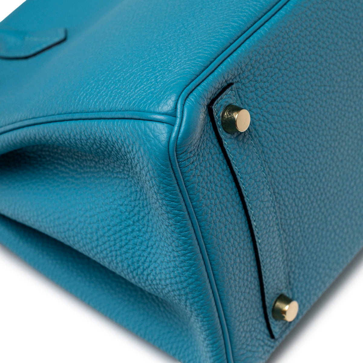 Close-up of bottom corner and gold hardware feet on Hermès Birkin 30 Turquoise Togo Gold Hardware handbag