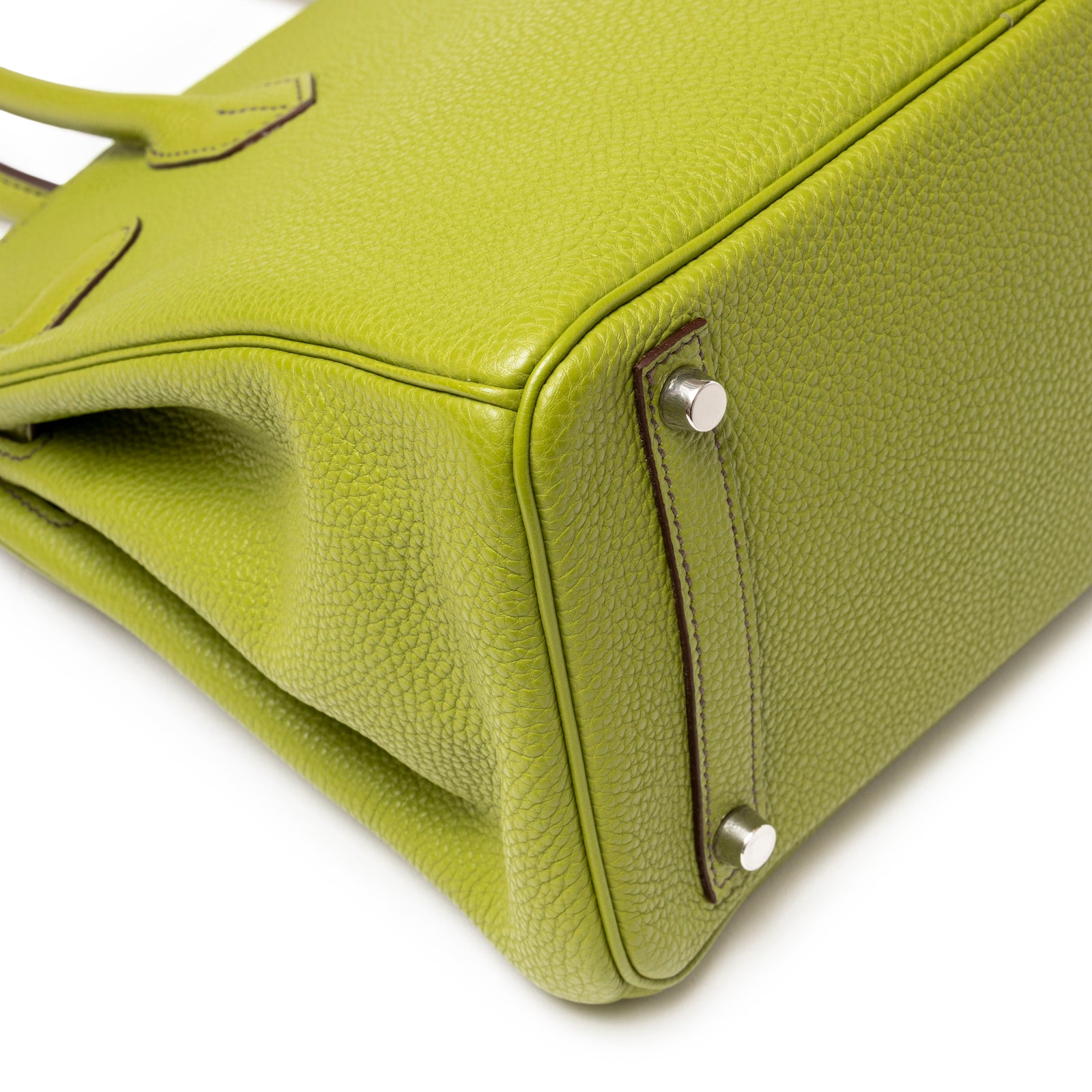 Close-up of Hermès Birkin 30 Vert Anis Togo Palladium Hardware showing palladium feet and textured leather corner details