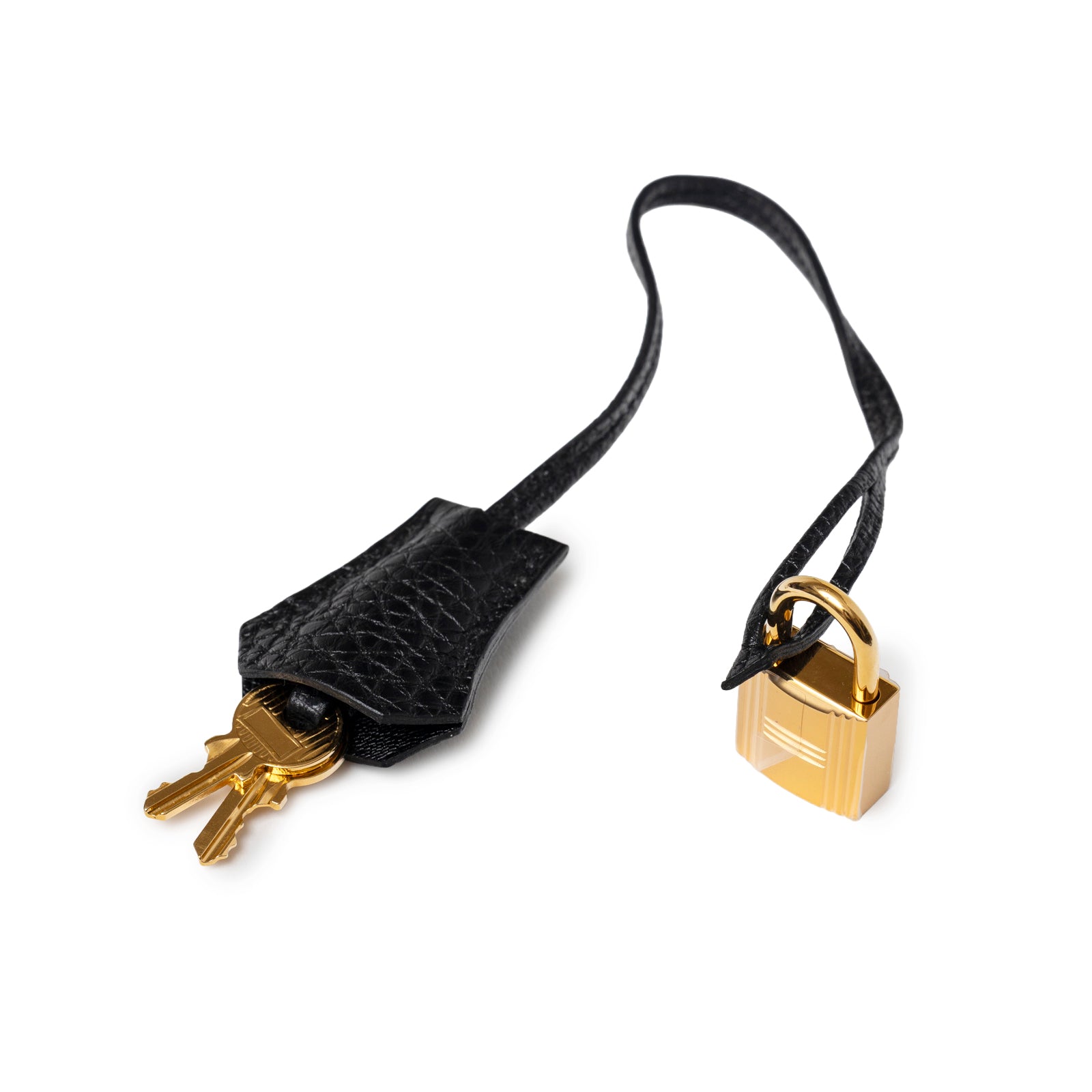 Close-up of Hermès Birkin 35 Black Togo Gold Hardware lock and key clochette with smooth leather strap detail