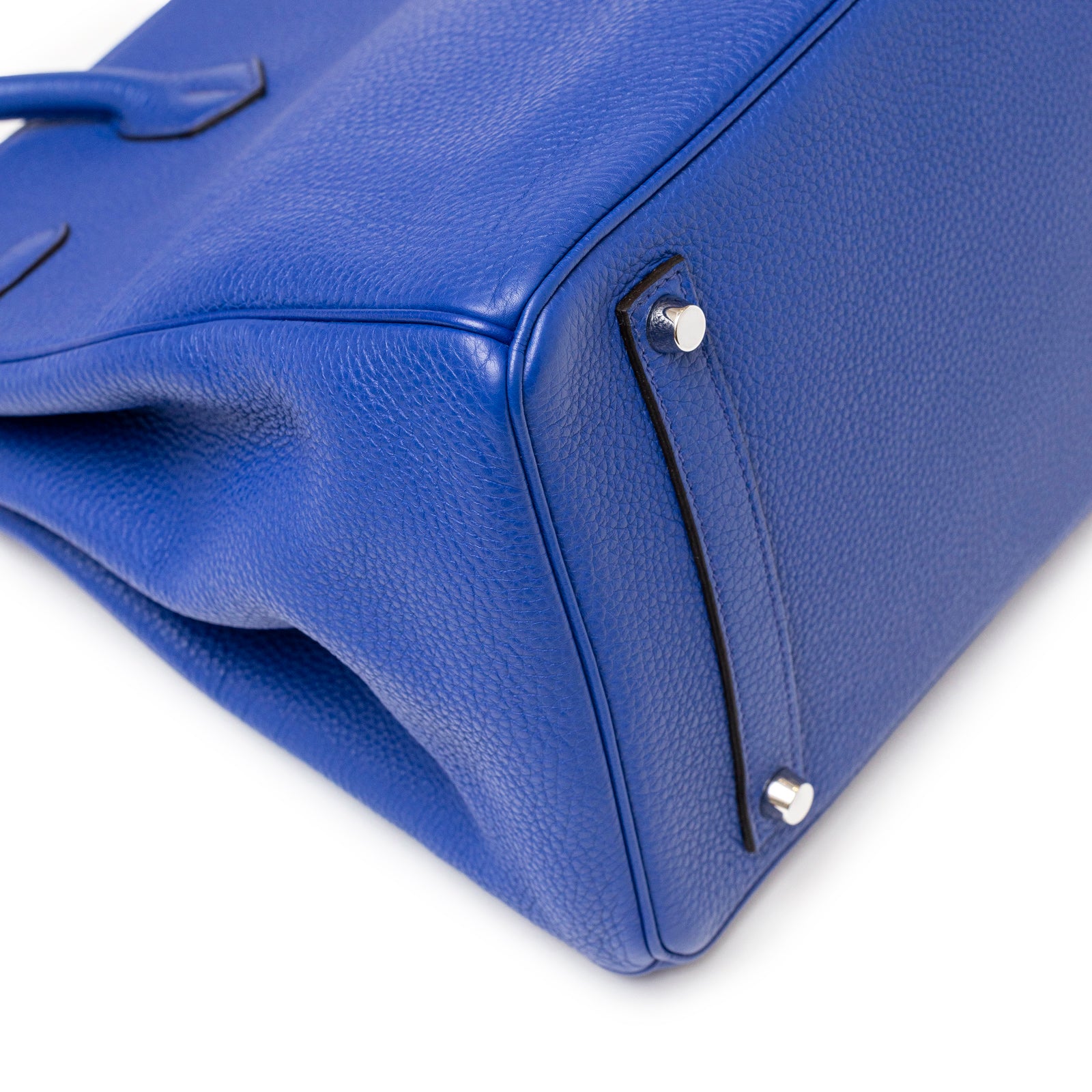 Close-up view of the bottom corner and textured leather detailing of Hermès Birkin 35 Blue Electric Togo Palladium Hardware handbag