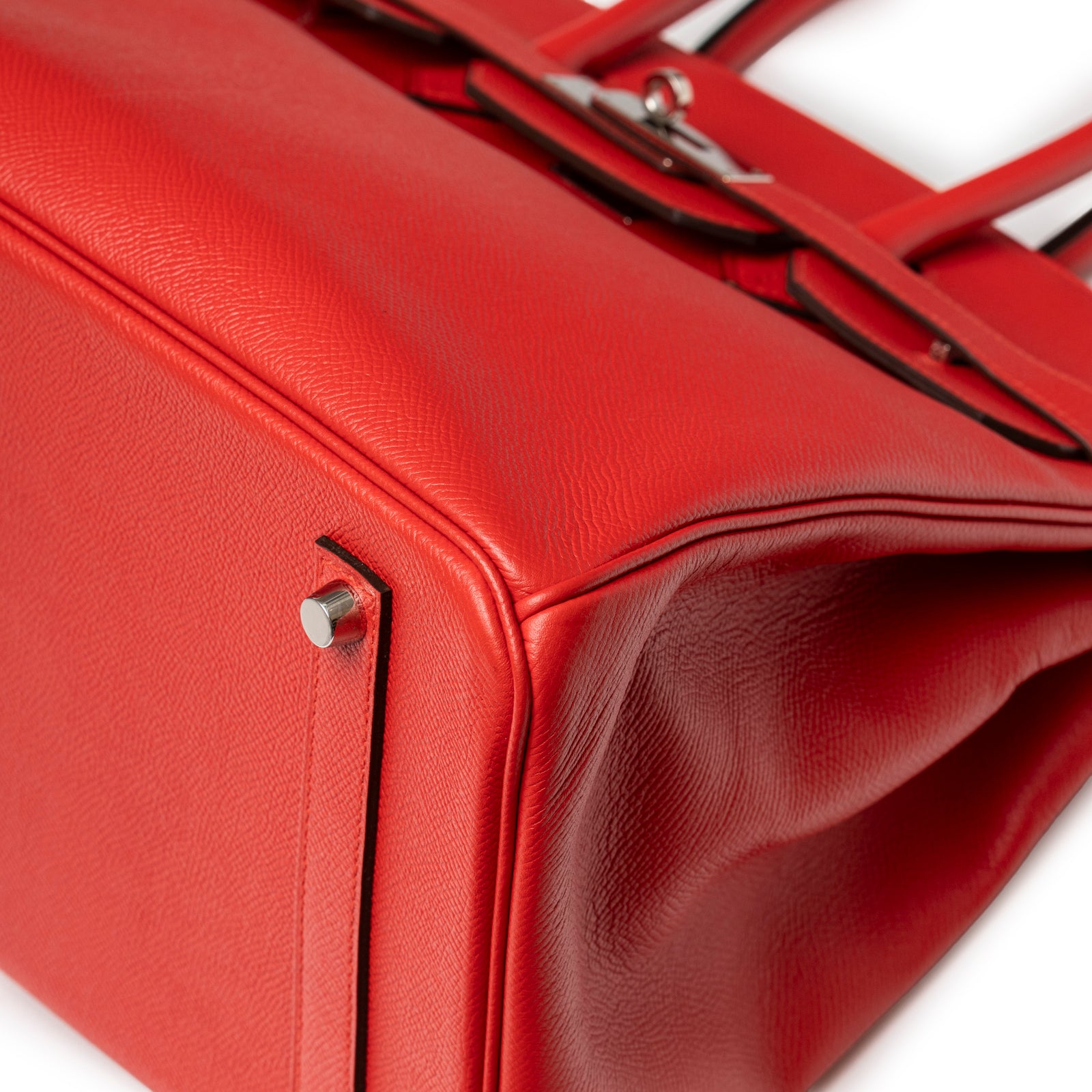 Close-up of bottom corner and protective feet on Hermès Birkin 35 Bougainvillea Epsom Palladium Hardware handbag