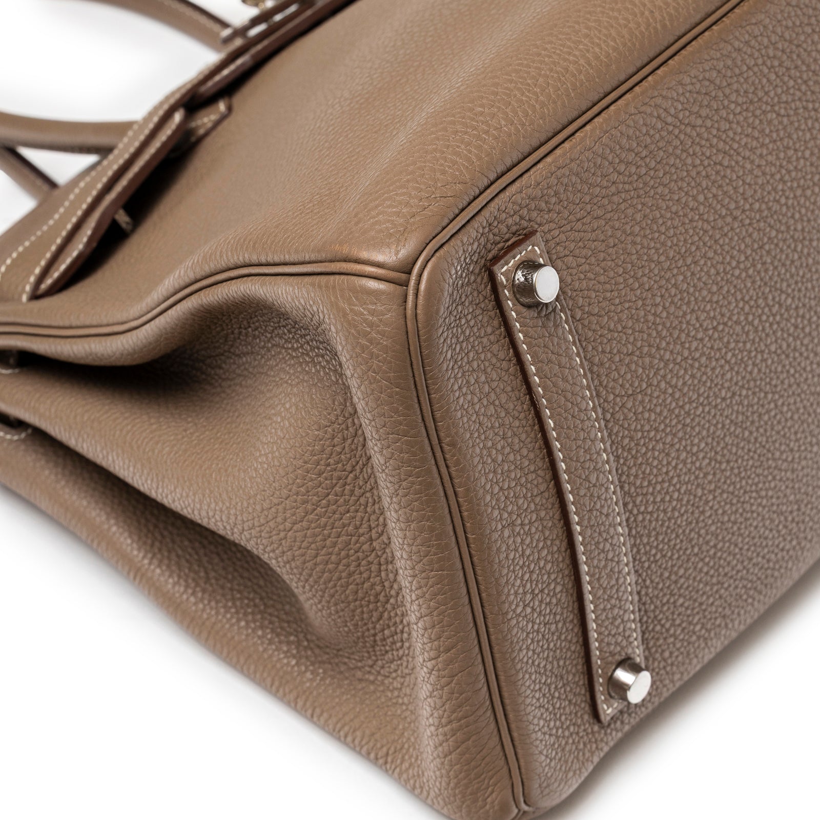 Close-up of Hermès Birkin 35 Etoupe Togo Palladium Hardware focusing on textured leather and bottom corner studs detail