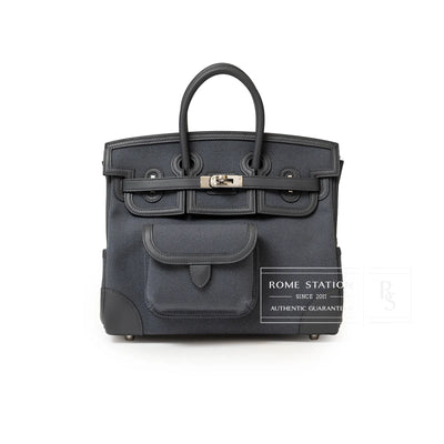 Front view of Hermès Birkin Cargo 25 in dark gray canvas with leather trim and palladium hardware clasp detail