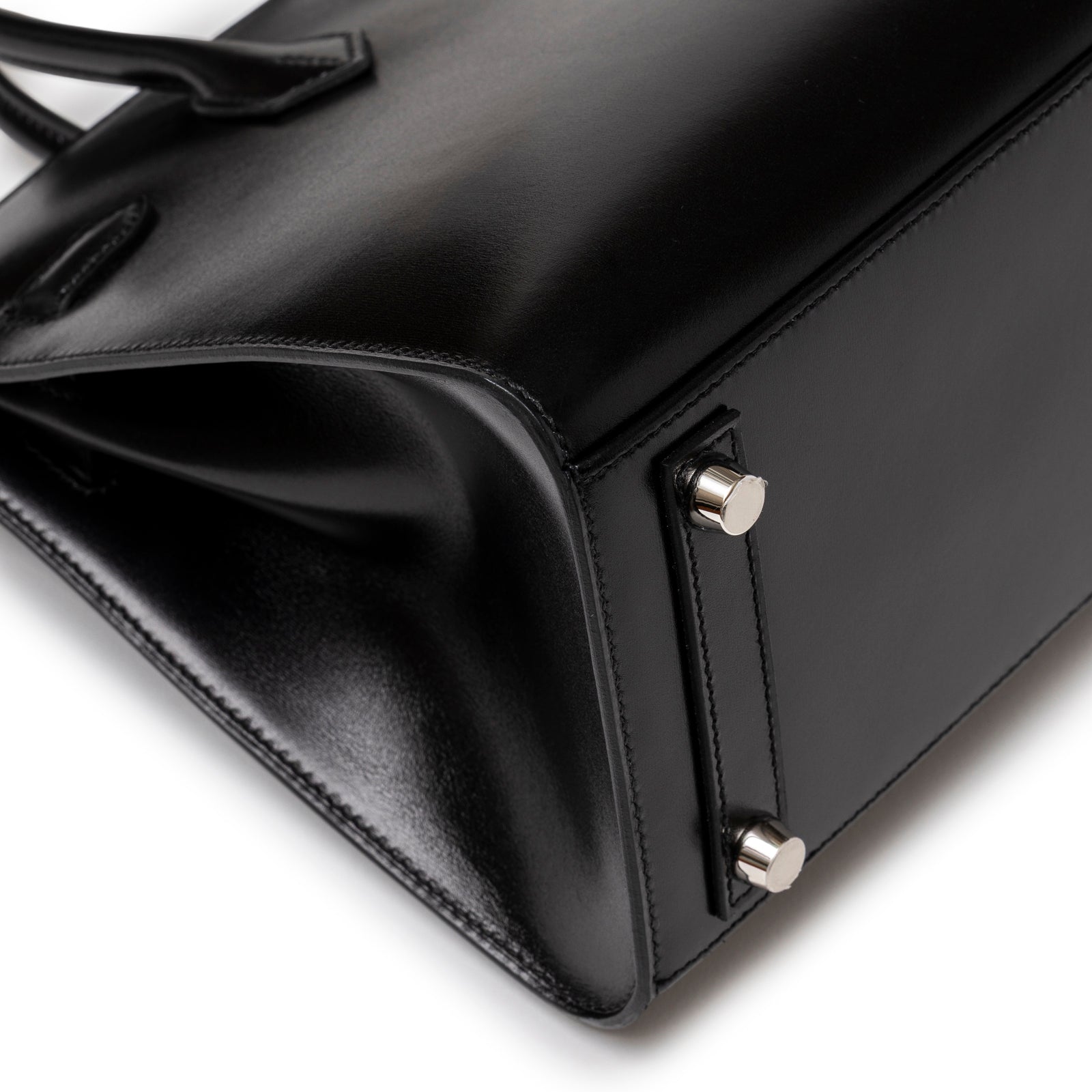 Close-up of base and corner details on Hermès Birkin Sellier 25 Black Box Palladium Hardware handbag