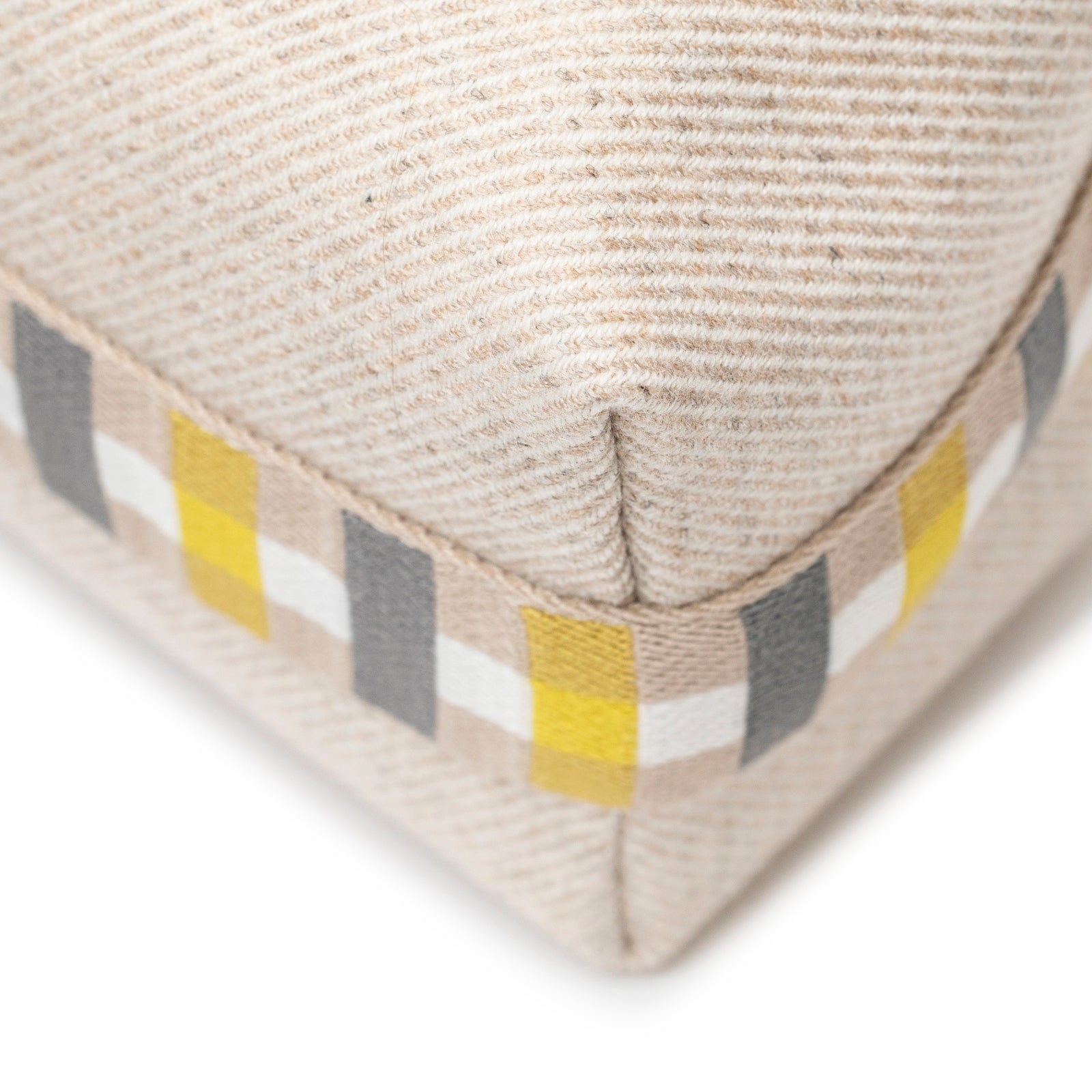 Close-up of corner detail on Hermès Bride-a-Brac au Carre Case Small Model Seigle with woven textured fabric and colorful stripes
