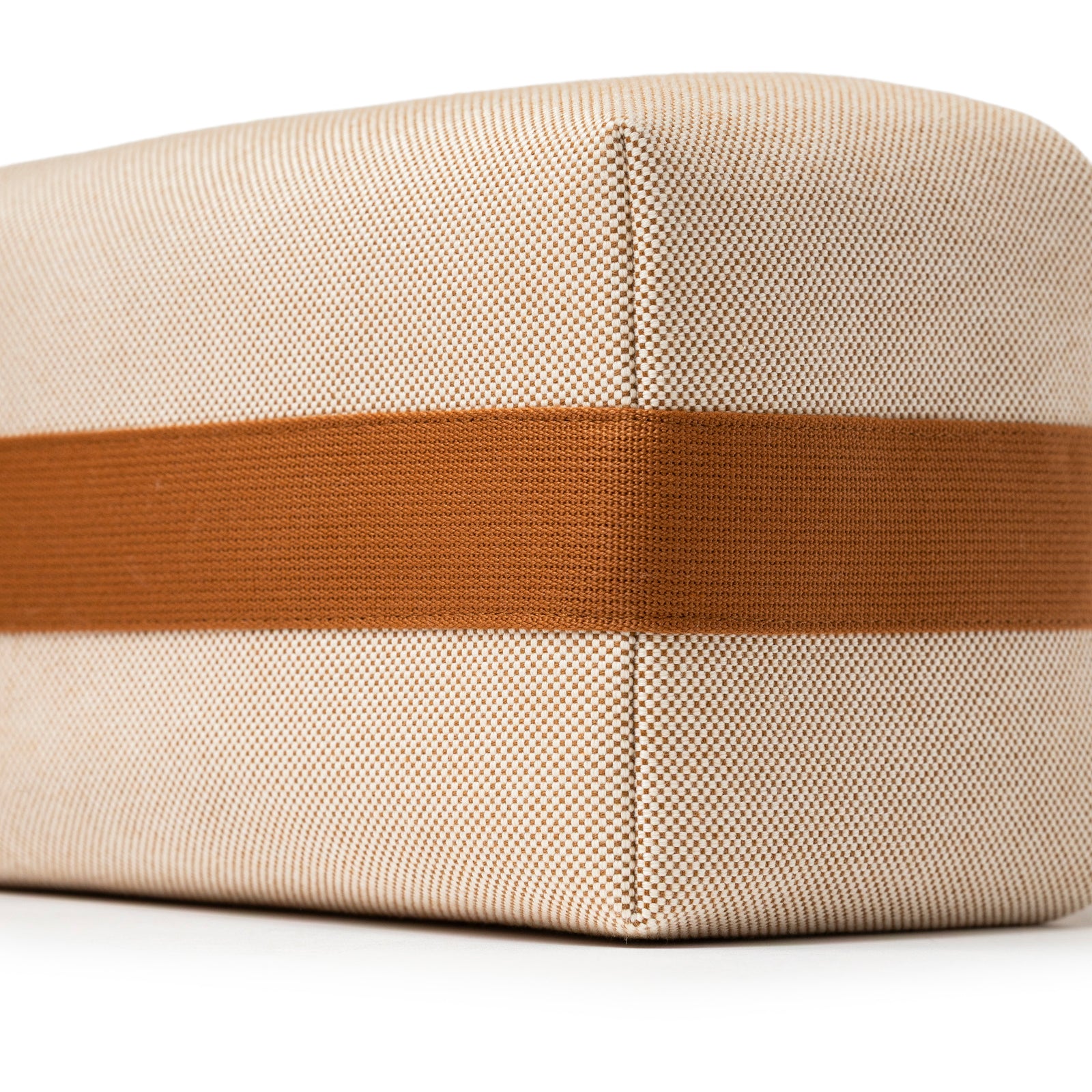 Close-up of corner detail on Hermès Bride-A-Brac Cabriole Case GM Toile Biscuit in beige canvas with brown stripe