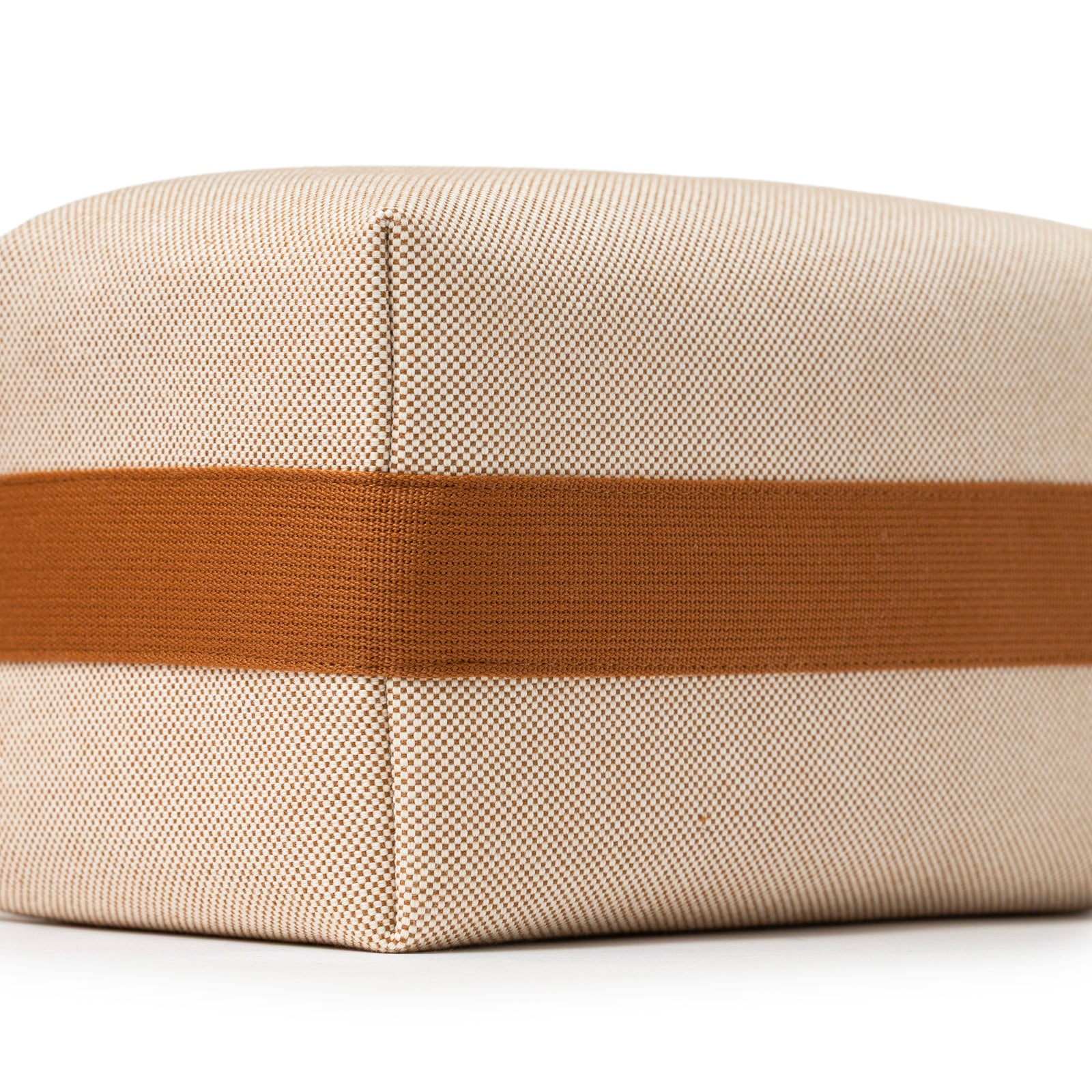 Close-up angled view of Hermès Bride-A-Brac Cabriole Case GM Toile Biscuit fabric and bottom corner detail.
