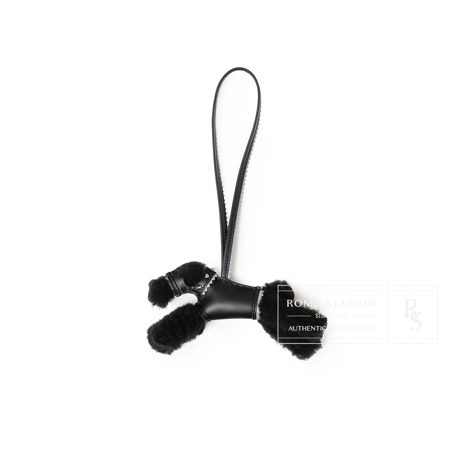 Front angled view of Hermès Budy Charm Black/Gris Pantin Milo Lambskin/Epsom shaped like a poodle with leather strap
