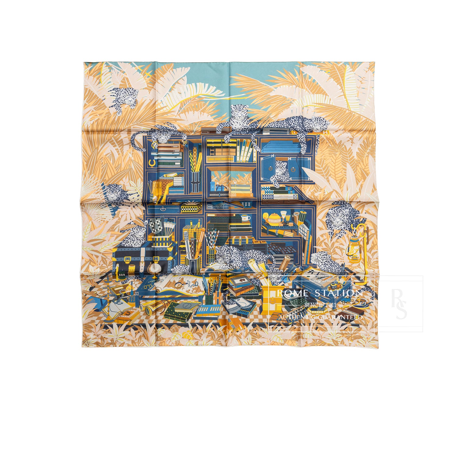 Top-down view of Hermès Carre 90 Double Face Les Douze Leopards Blue Beige Jaune scarf with detailed leopard and foliage design